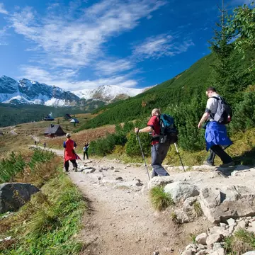 A trio hikes a mountain trail near Zakopane. tramper79 / Shutterstock