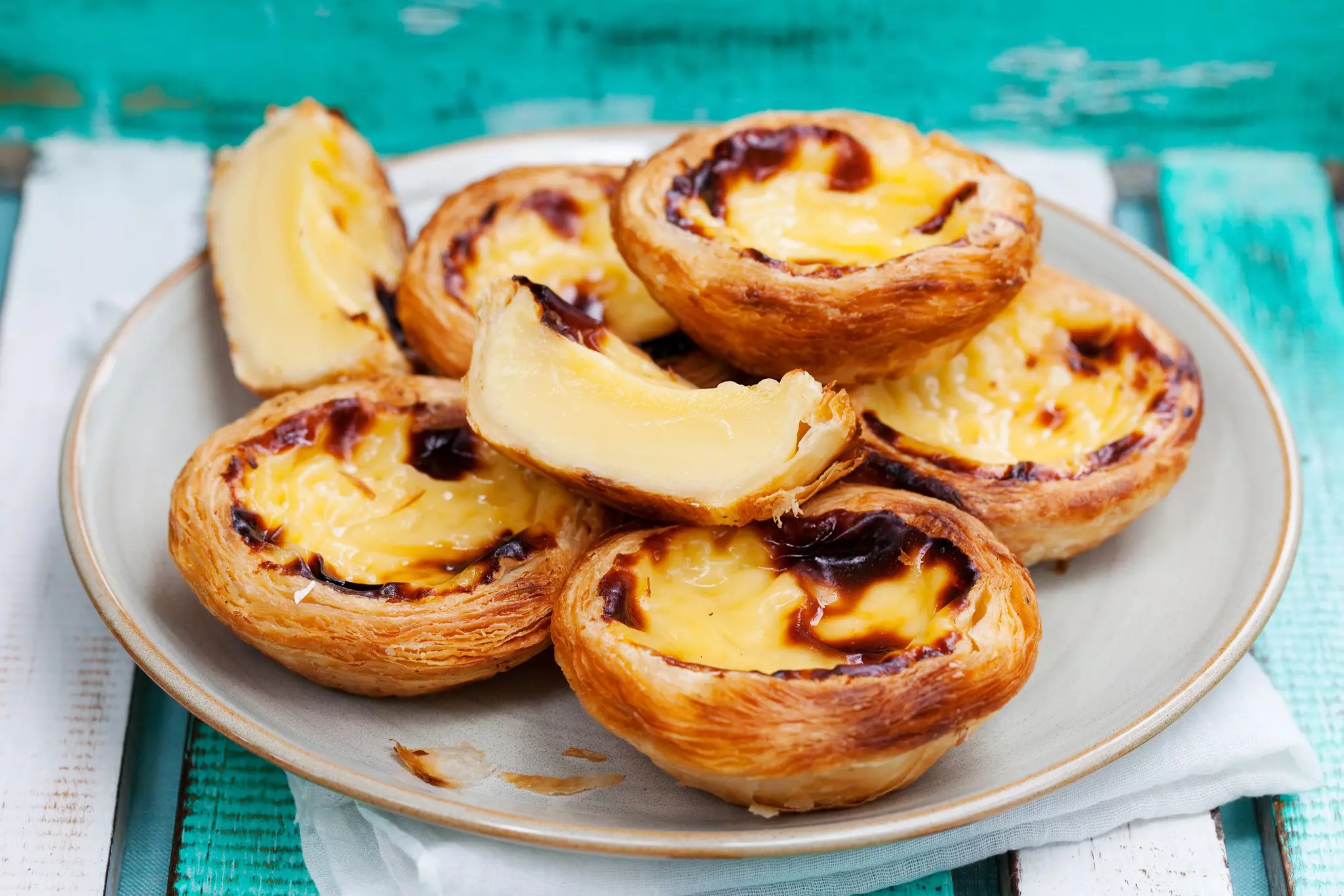 Custard tarts are some of Portugal’s best and most beloved desserts © Anna_Pustynnikova / Shutterstock