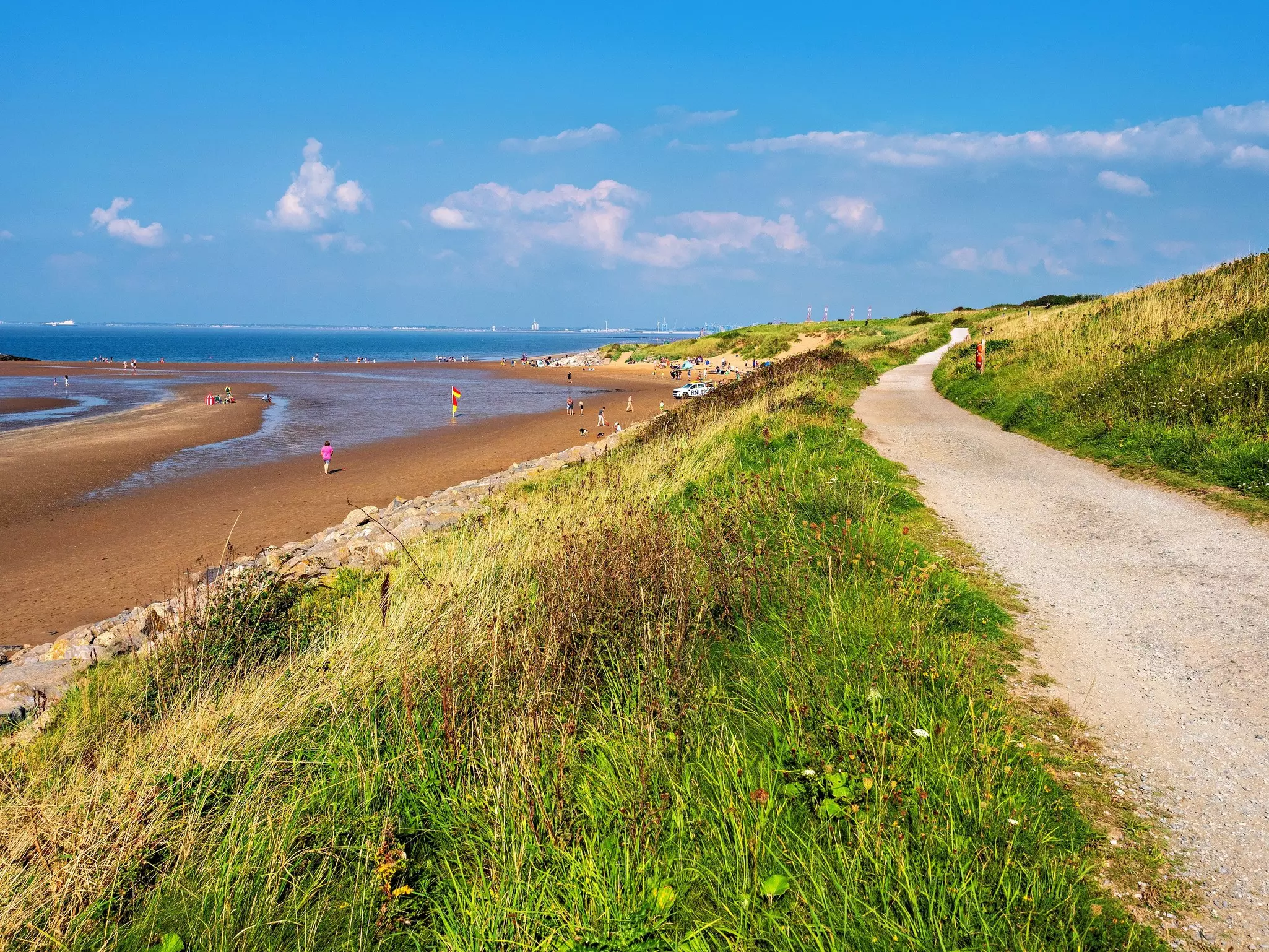 A coastal park beside a sandy beach