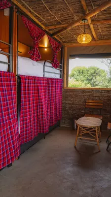 Curtained bunk beds give privacy in a dorm room.