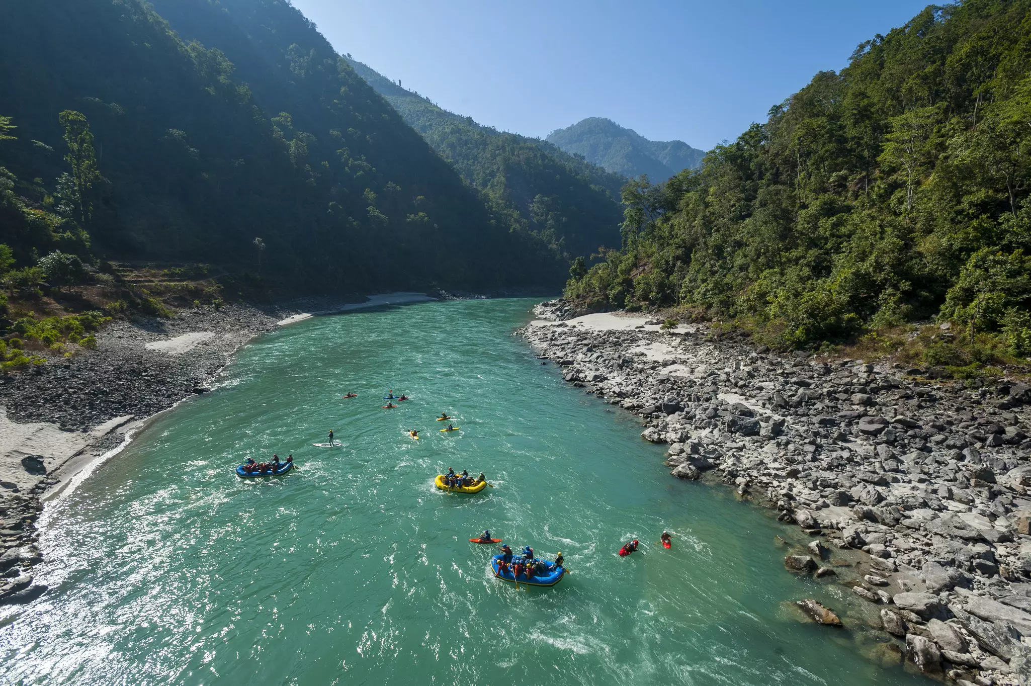 People rafting and kayaking on the Karnali River