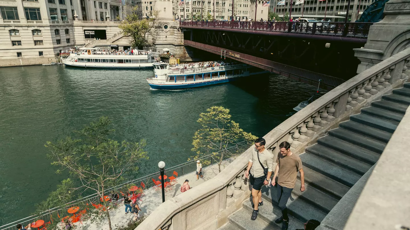 People walking along the Riverwalk in Chicago.
