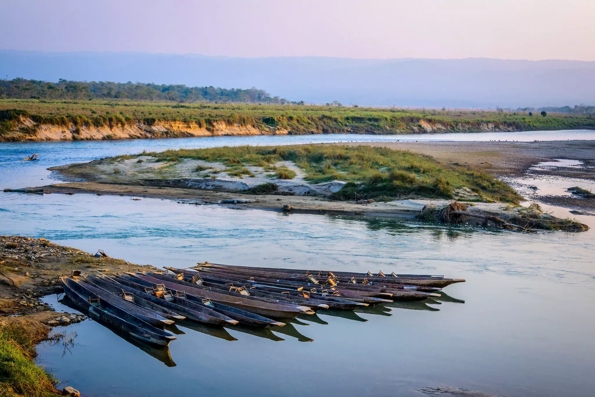 Pirogues on the Rapti river in Chitwan, Nepal