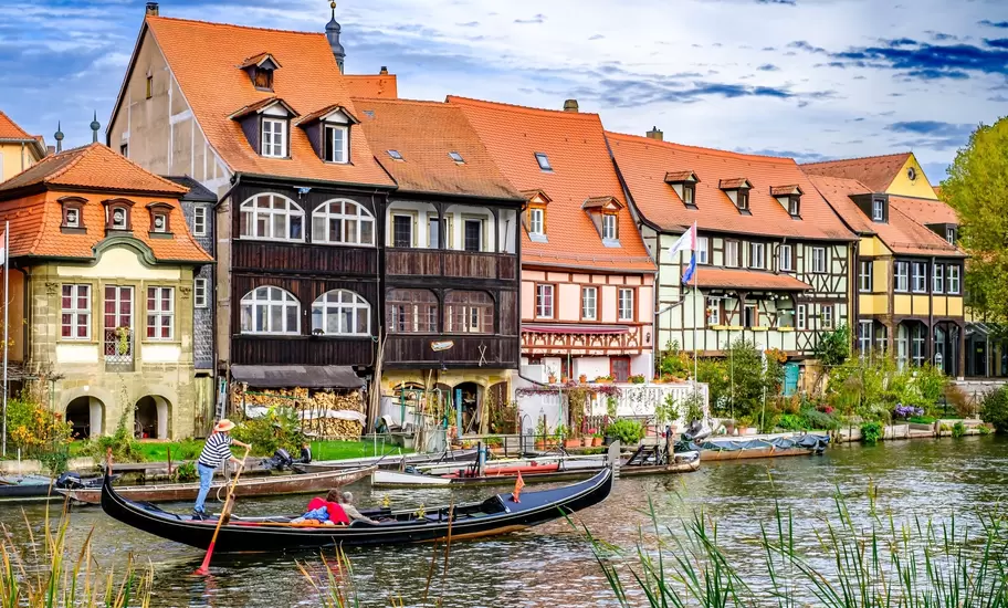 Bamberg, Germany - October 23: historic buildings and a gondola at the famous old town of Bamberg on October 23, 2022, License Type: media, Download Time: 2026-02-11T12:15:41.000Z, User: robinbarton170, Editorial: true, purchase_order: 56500 - T&R or Kids, job: Global Publishing-WIP, client: The Travel Book 5, other: Robin Barton