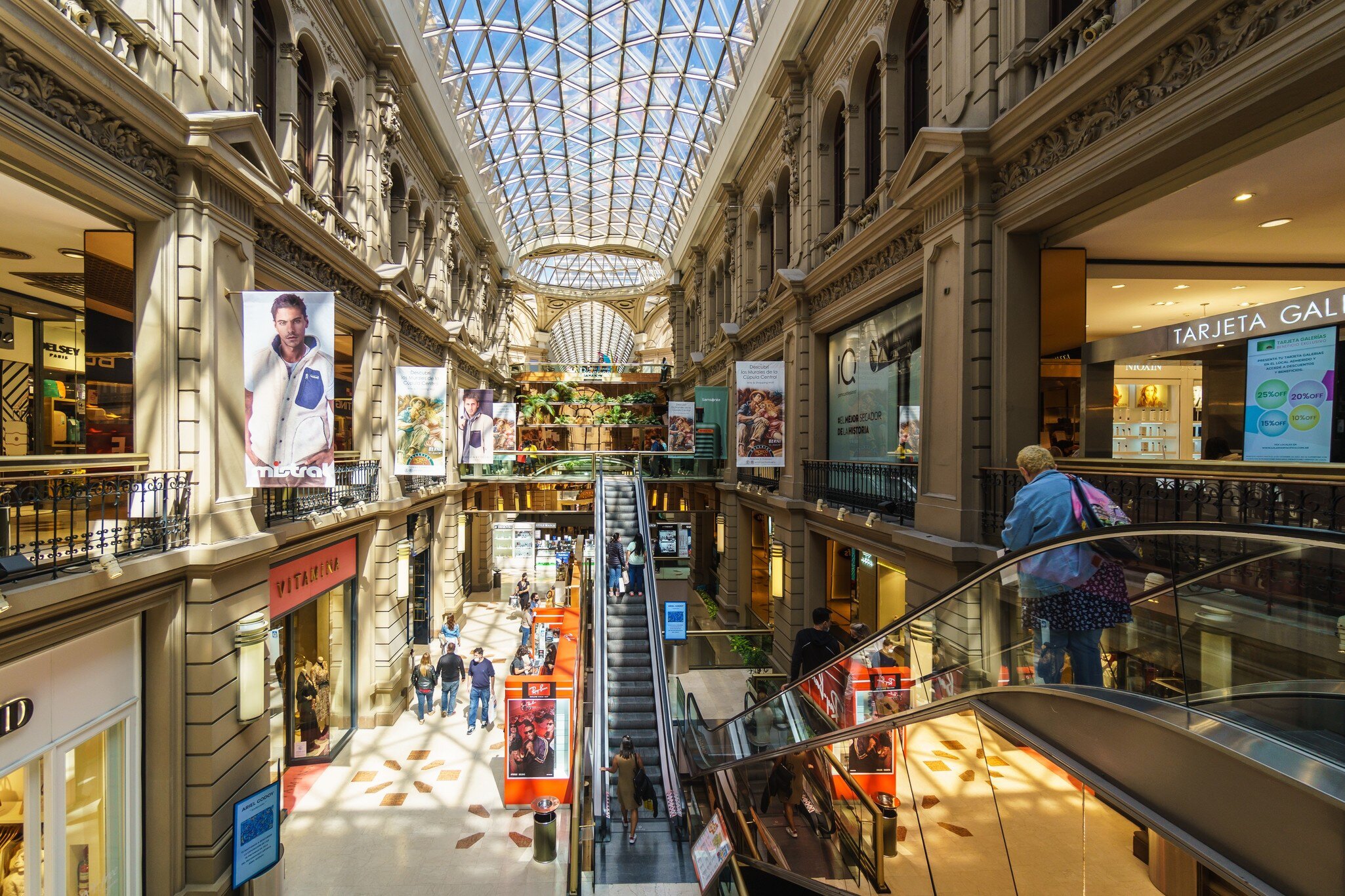 Buenos Aires, Argentina - March 19 2022: People shop in the prestigious Galerías Pacífico / Galerias Pacifico in Buenos Aires city center. The buildings dates back to 1889.  License Type: media  Download Time: 2022-12-15T18:16:24.000Z  User: lonelyplanetmedia  Is Editorial: Yes  purchase_order: