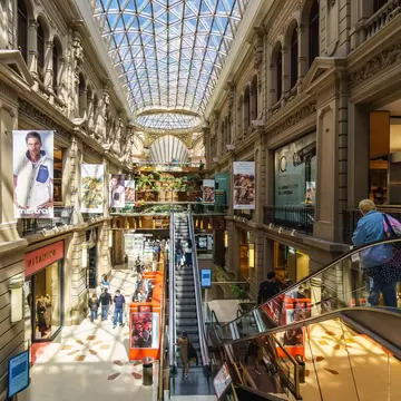 Buenos Aires, Argentina - March 19 2022: People shop in the prestigious Galerías Pacífico / Galerias Pacifico in Buenos Aires city center. The buildings dates back to 1889.  License Type: media  Download Time: 2022-12-15T18:16:24.000Z  User: lonelyplanetmedia  Is Editorial: Yes  purchase_order: