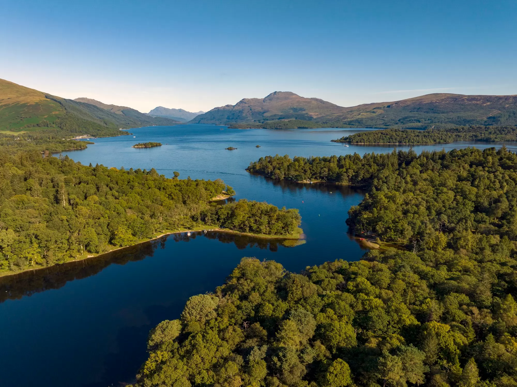 Island-dotted Loch Lomond is a playground for hikers and water sports and boating enthusiasts. Sky View Video (Scotland)/Getty Images