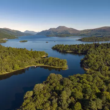 Island-dotted Loch Lomond is a playground for hikers and water sports and boating enthusiasts. Sky View Video (Scotland)/Getty Images