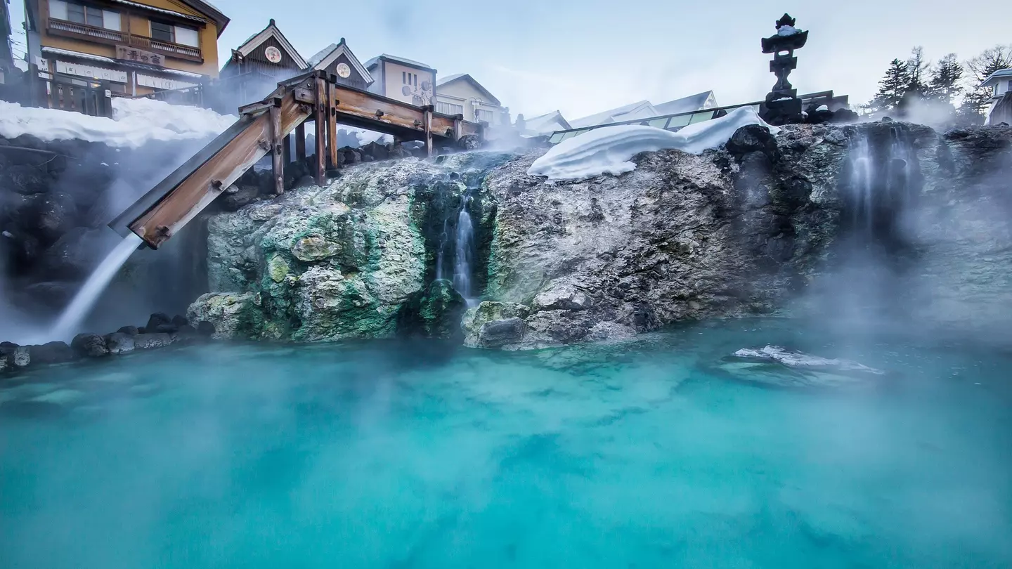 Hot water gushes down wooden channels at Yubatake, in Kusatsu Onsen © dekitateyo / Shutterstock