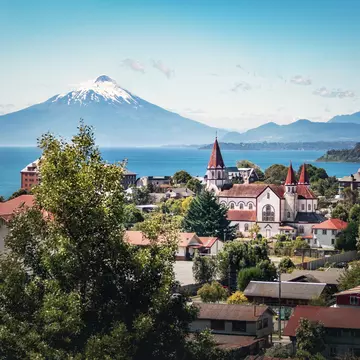 Aerial of Puerto Varas with Sacred Heart Church and Osorno Volcano in the background.