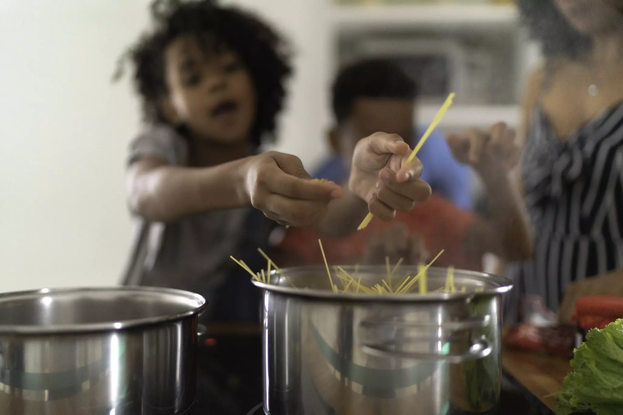 Family Cooking Together at Kitchen