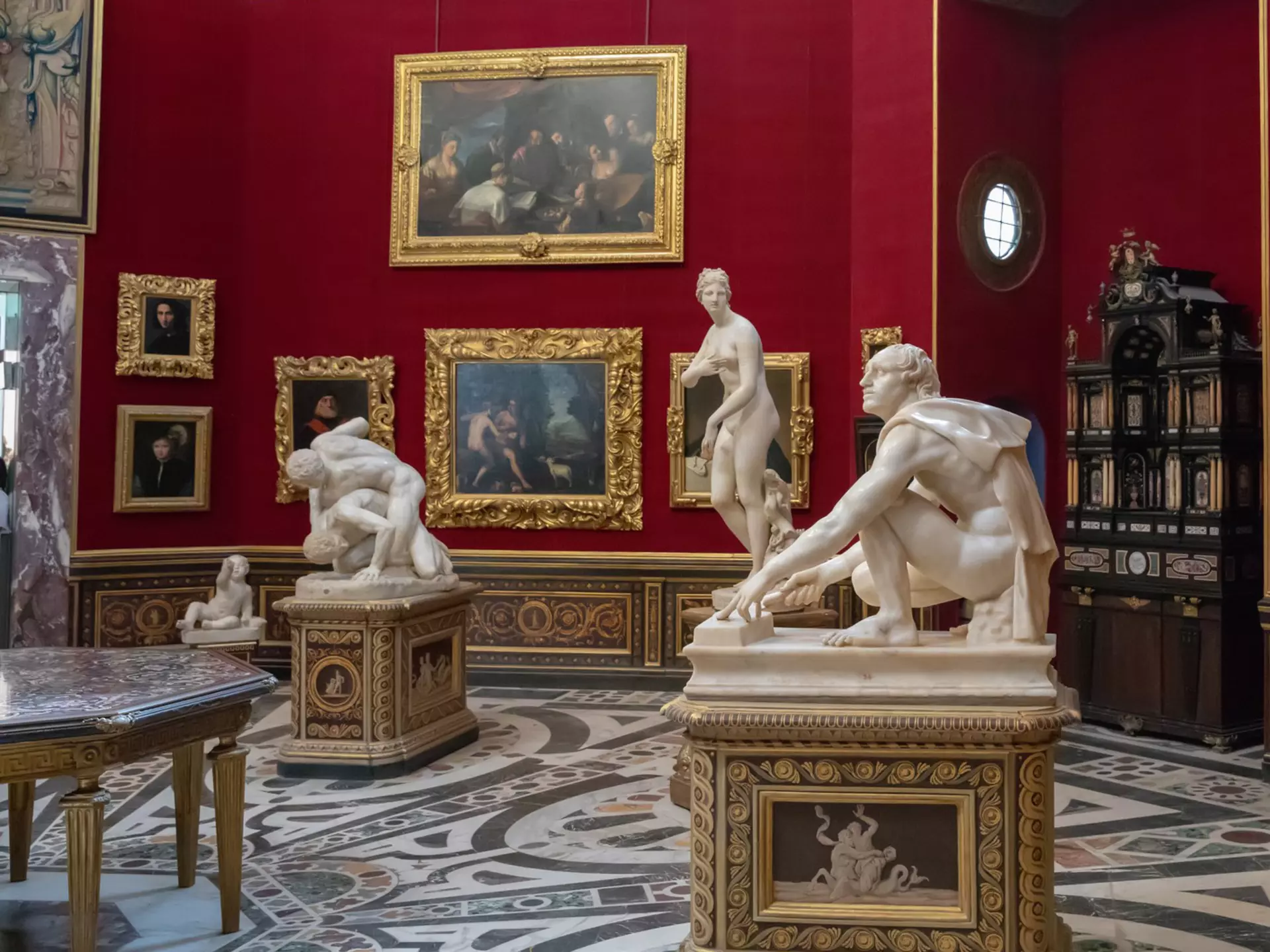 Statues inside the Tribuna degli Uffizi room at the Galleria degli Uffizi in Florence, Italy.