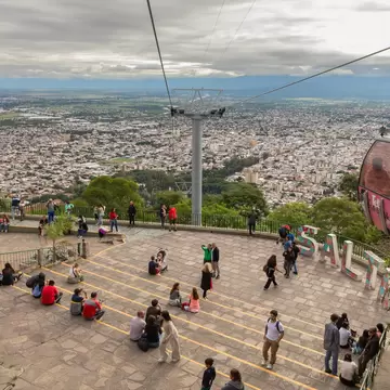 Visitors wander atop San Bernardo hill overlooking the historic city of Salta, Argentina. 