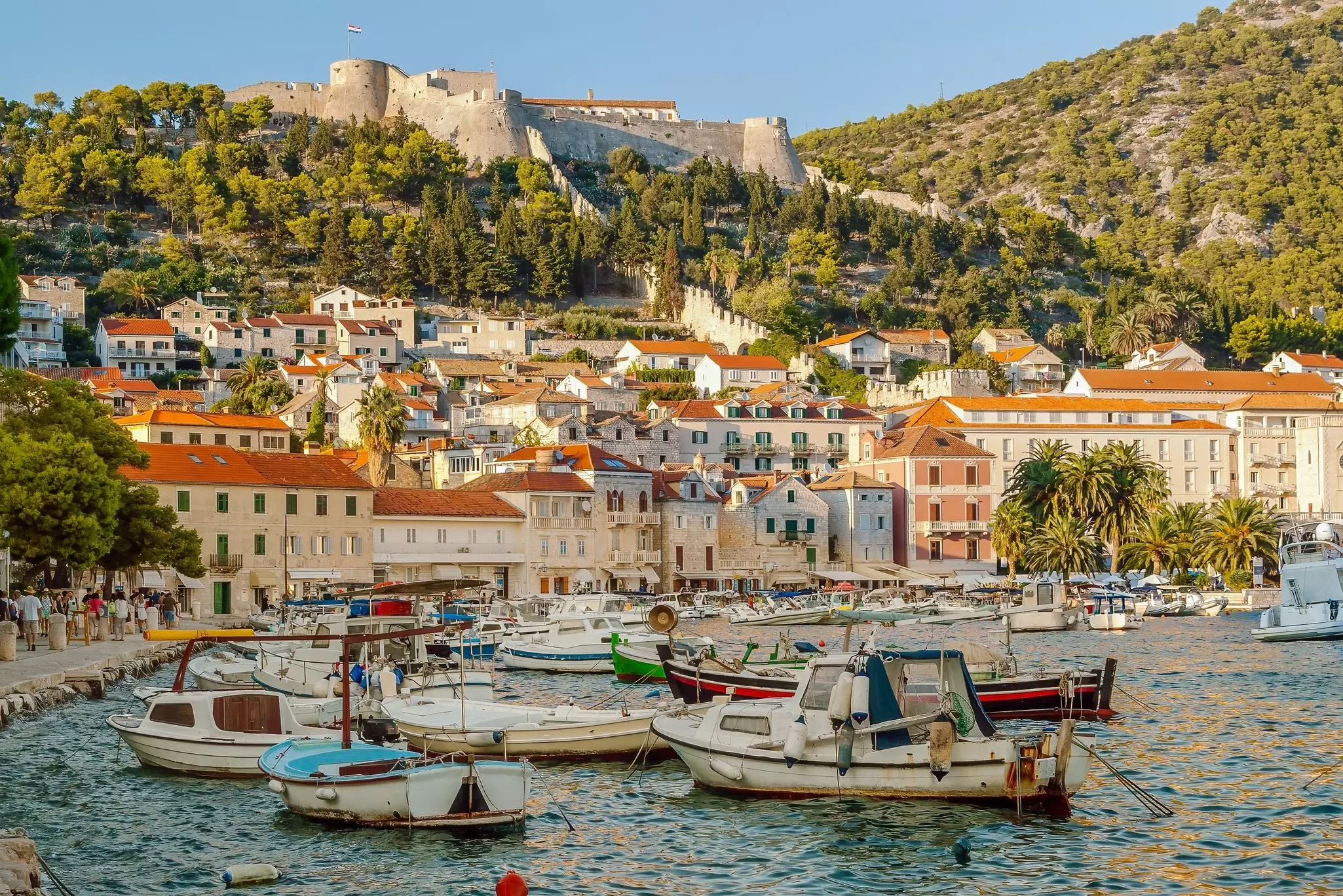 Hvar harbour in the old town of Hvar and the Spanish fortress above the town, Dalmatia, Croatia