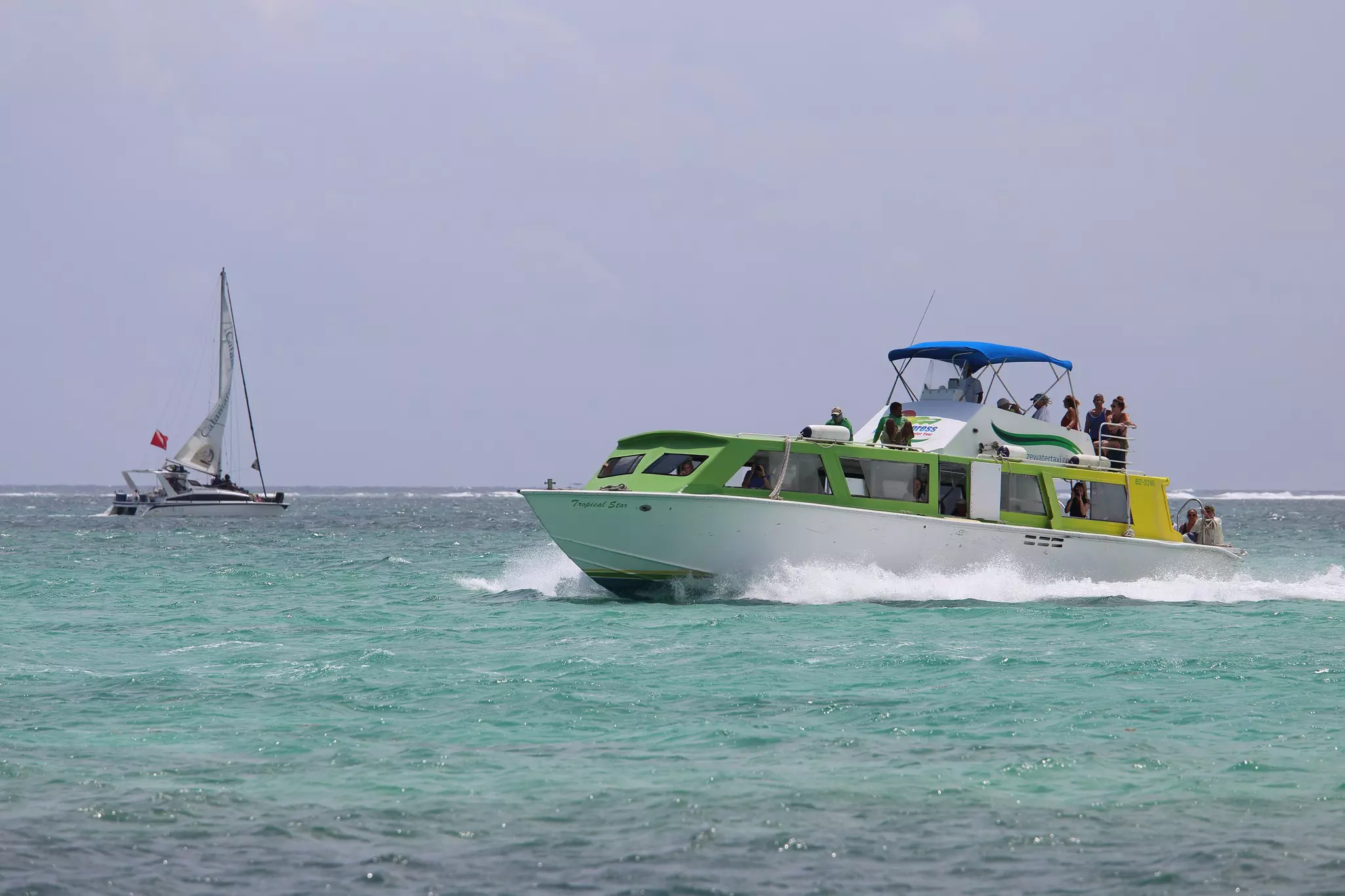 Ambergris Caye / Belize - March 17 2018: Water taxi going back and forth in Ambergris Caye, License Type: media, Download Time: 2025-12-10T18:34:28.000Z, User: bhealy950, Editorial: true, purchase_order: 65050 - Digital Destinations and Articles, job: Lonely Planet Online Editorial, client: Guide to Belize, other: Brian Healy