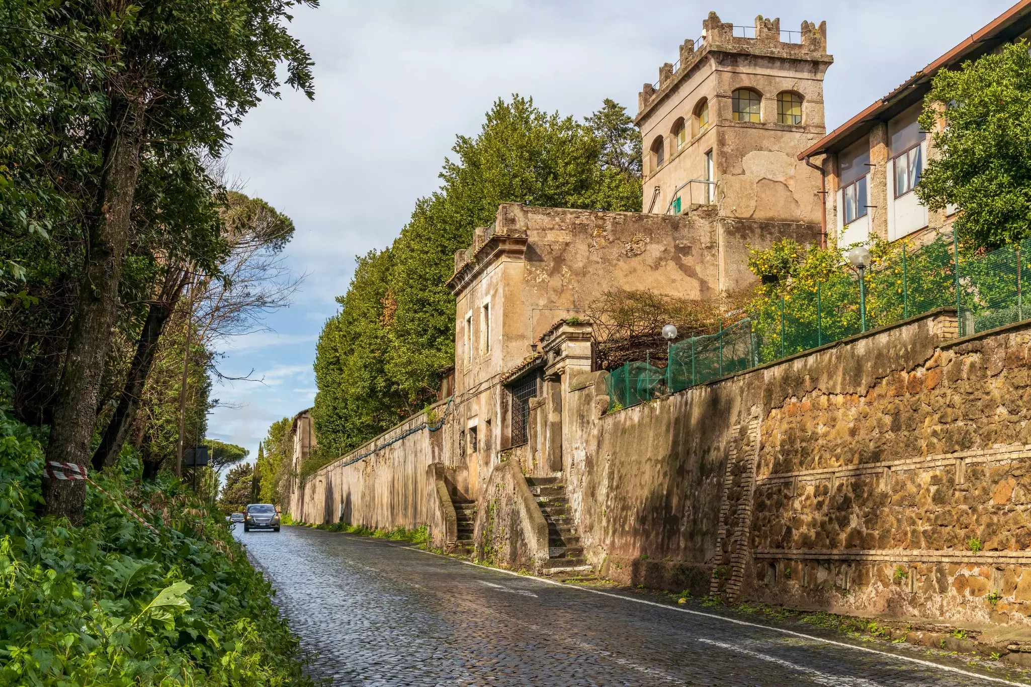 Cars driving along a section of the Via Appia Antica in Rome