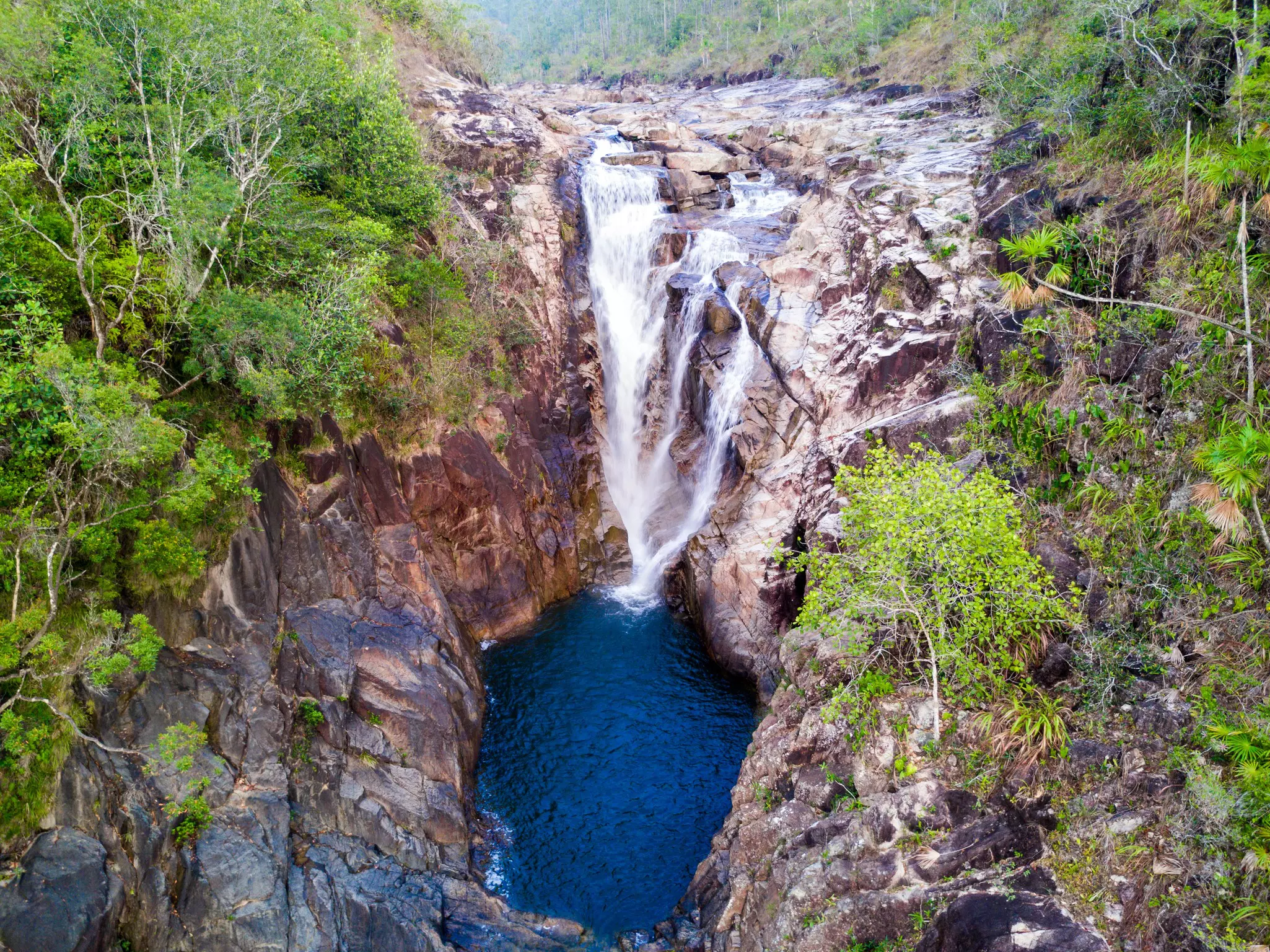 Take a refreshing dip at Big Rock Falls while you're in Belize. Gaby Sill/Shutterstock