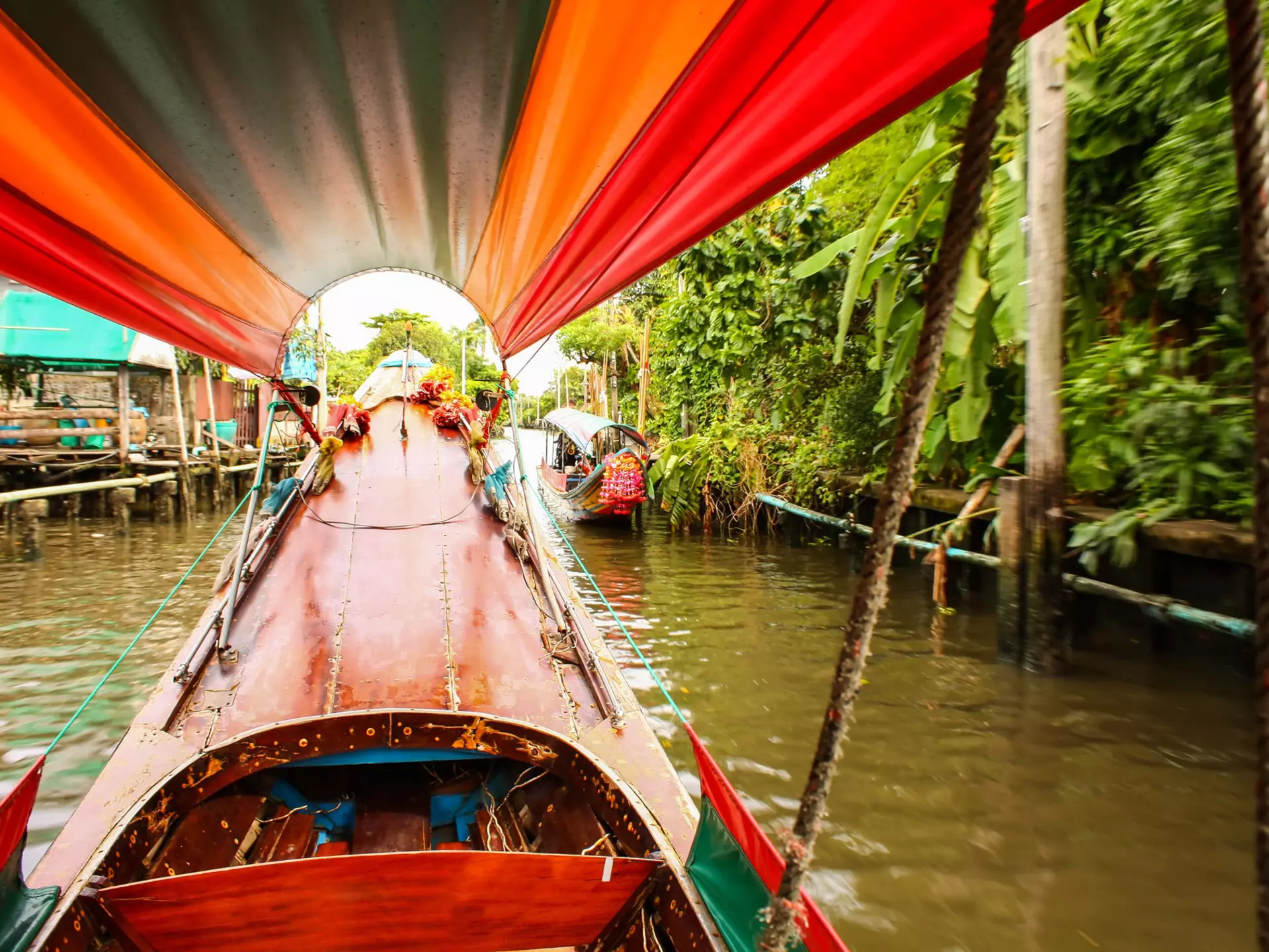 Trip through Bangkok canals down the Chao Phraya river on longtail boat
502751864
Travel, People Traveling, Tourism, Cruise, Leisure Activity, No People, Floating On Water, Watering, Obsolete, Float, Chao Phraya Delta, Chao Phraya River, Floating Market, Ship's Bow, Color Image, Thai Culture, Scenics, Asian Ethnicity, Canoe, Bangkok, Thailand, Journey, Idyllic, Exoticism, Multi Colored, Shiny, Old-fashioned, Cultures, Long, Famous Place, Tropical Climate, Travel Destinations, Vacations, Transportation, Canoeing, Recreational Pursuit, Southeast Asia, Asia, Riverbank, River, Water, Decoration, Market, Canal, Cruise Ship, Nautical Vessel, Mode of Transport, Longtail, sports and fitness, River Trip, Scenics - Nature, Horizontal, Swimming Float, 2015, East Asian Ethnicity, 103626, Asian and Indian Ethnicities, Outdoors, Cruise - Vacation, Longtail Boat, Photography, Market - Retail Space, Capital Cities, Sport, Passenger Craft