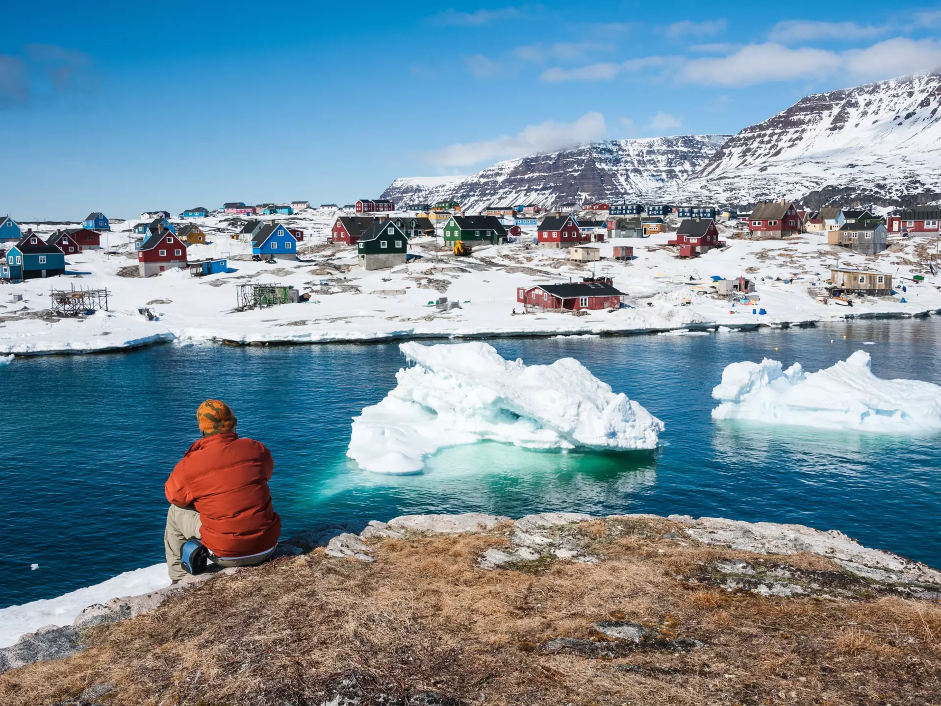 Tourist admiring wonderful views of Qeqertarsuaq, a small town of Greenland  ©Yongyut Kumsri/Shutterstock