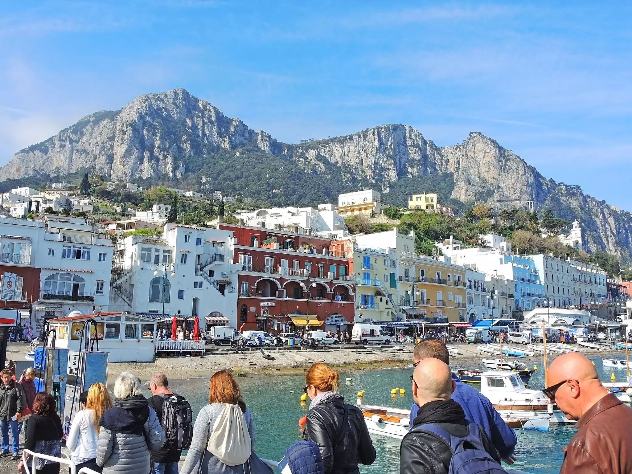 Tourists disembark a ferry in Capri, Italy. 