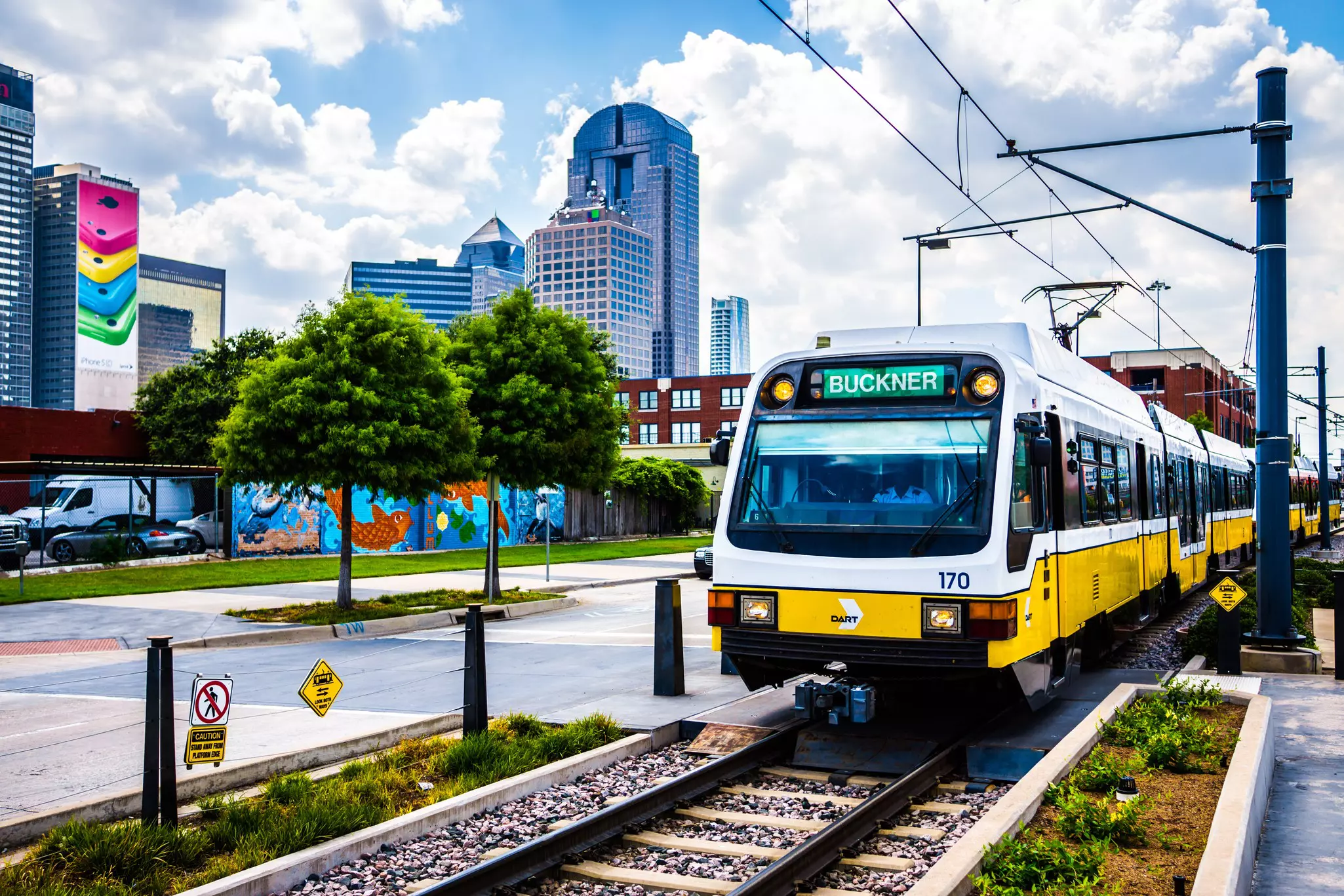 The Dallas DART light rail train drives through Deep Ellum in Dallas, Texas.