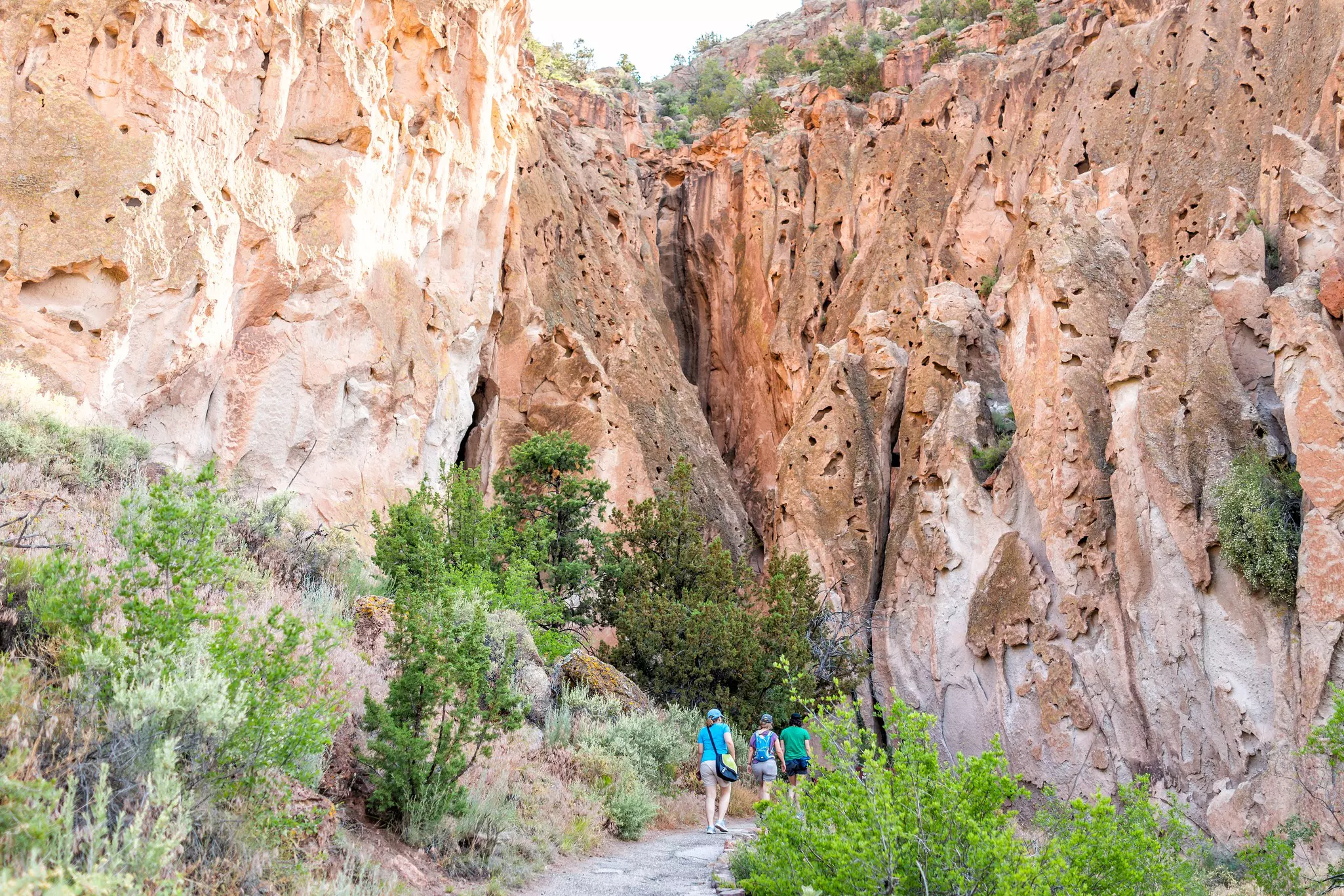 People on trail path in Bandelier National Monument in the Jemez Mountains, New Mexico