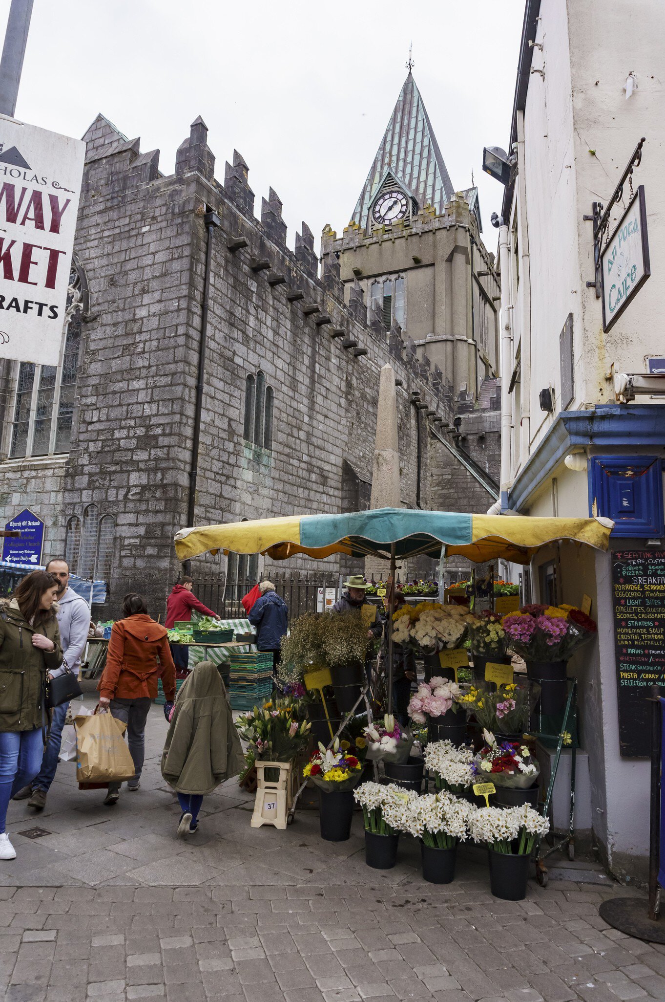 Flower stall Galway Market near The Augustinian Church in Galway, Ireland. Church in background. 