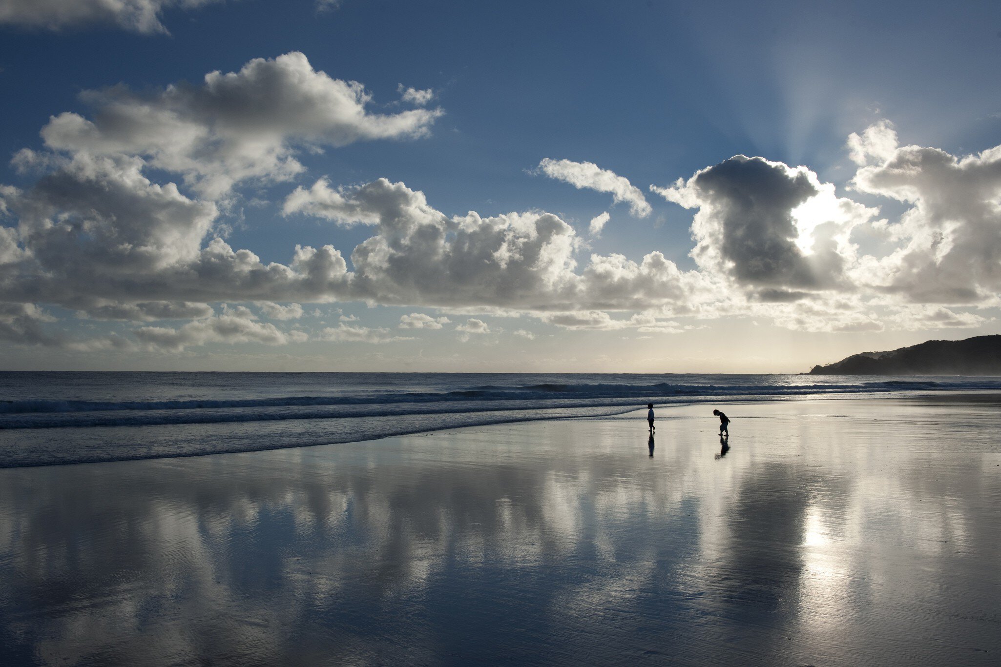 Children on beach in early morning.