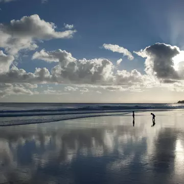 Children on beach in early morning.