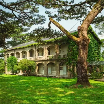 Pine Garden, a former Japanese military office in Hualien, Taiwan, covered in green ivy and surrounded by trees.