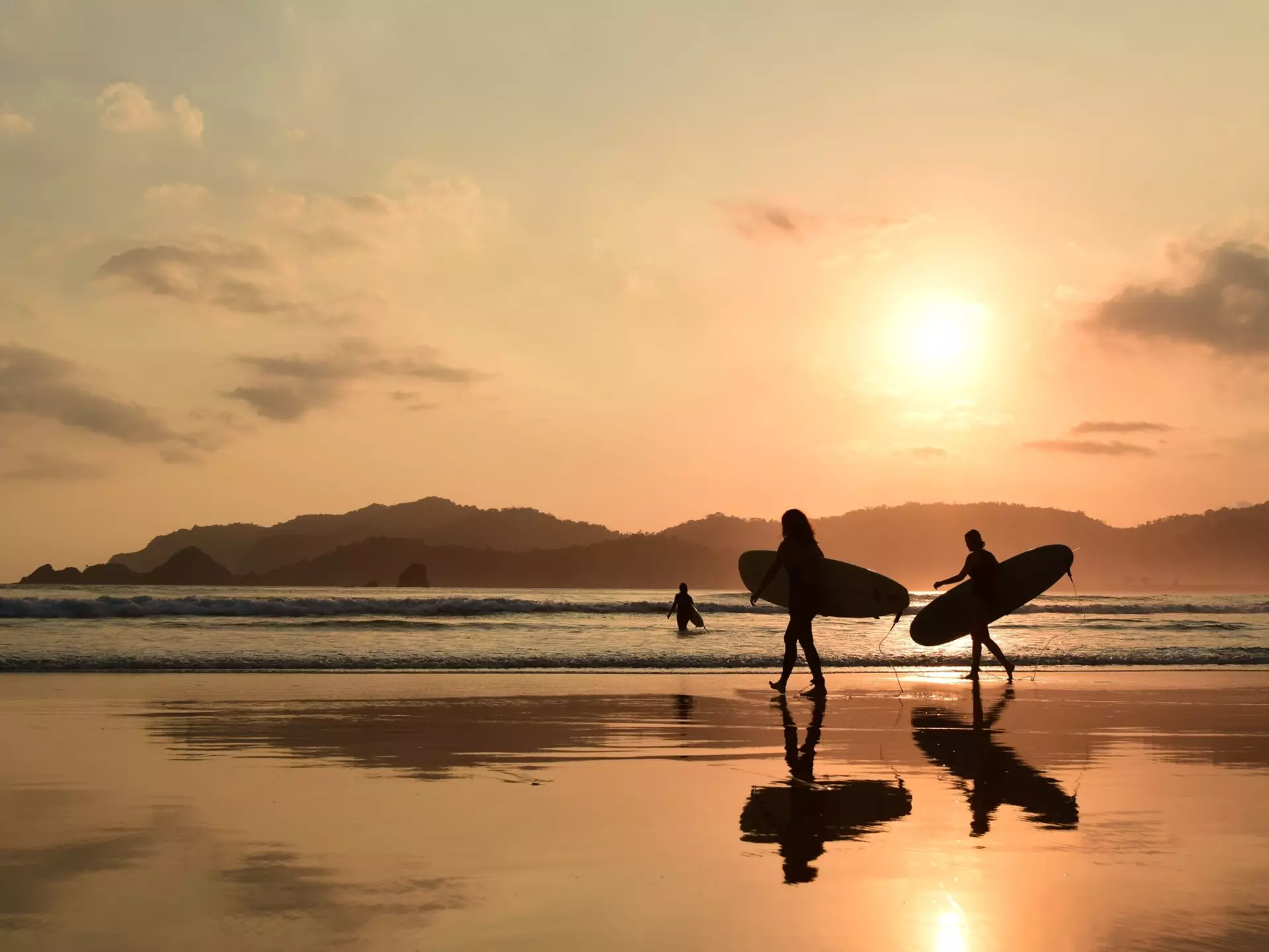 Banyuwangi, Indonesia: Pantai Pulau Merah known for its stunning beauty destination for locals and tourists, offering a serene environment, scenic views, and a variety of activities.