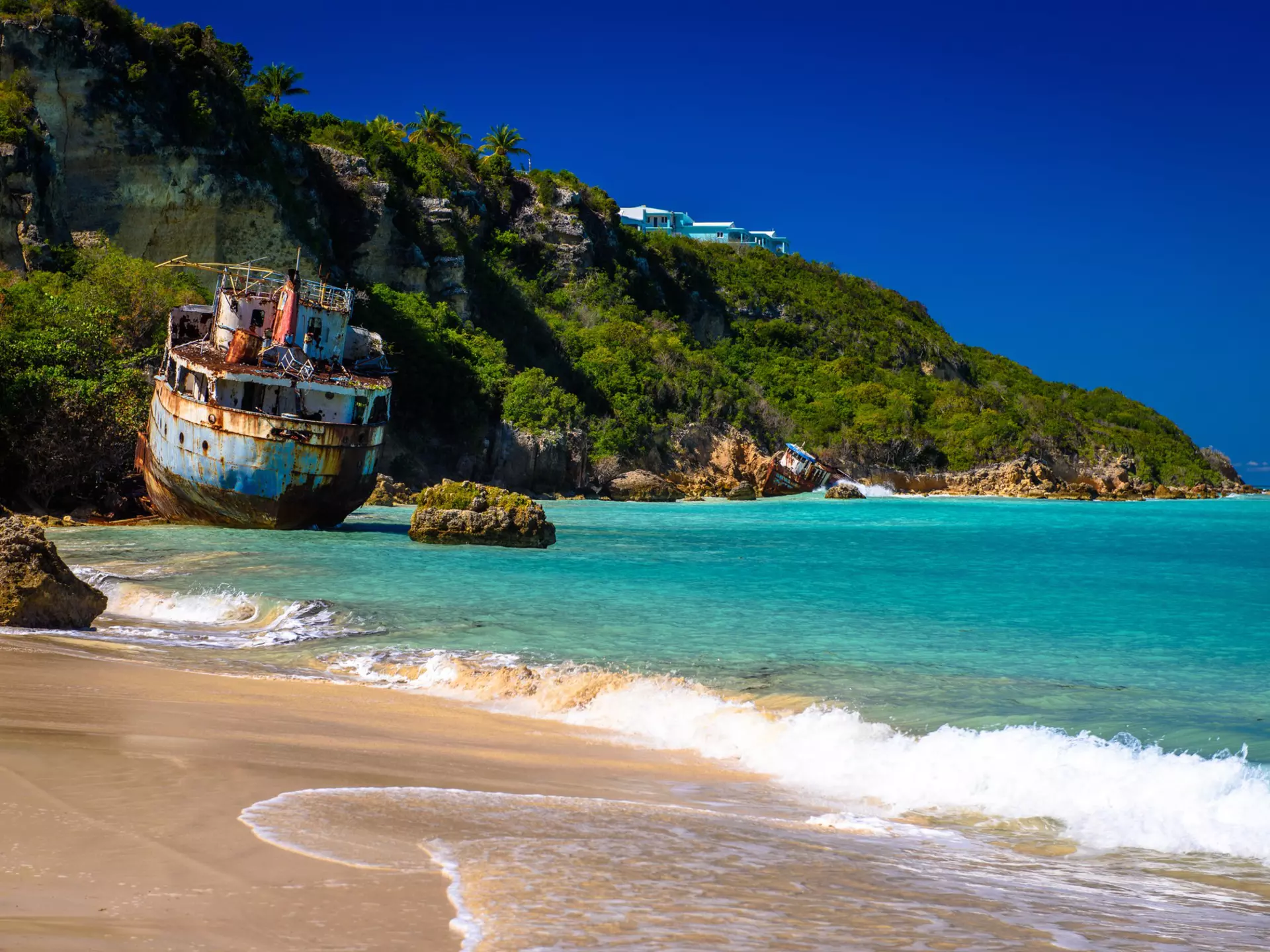 Shipwrecks lay in ruins on the shores of Sandy Ground Beach, on the island of Anguilla in the Caribbean. (3415)  License Type: media  Download Time: 2021-10-26T21:00:48.000Z  User:   Is Editorial: No  purchase_order:   