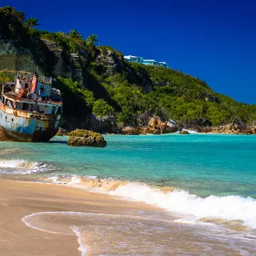 Shipwrecks lay in ruins on the shores of Sandy Ground Beach, on the island of Anguilla in the Caribbean. (3415)  License Type: media  Download Time: 2021-10-26T21:00:48.000Z  User:   Is Editorial: No  purchase_order:   