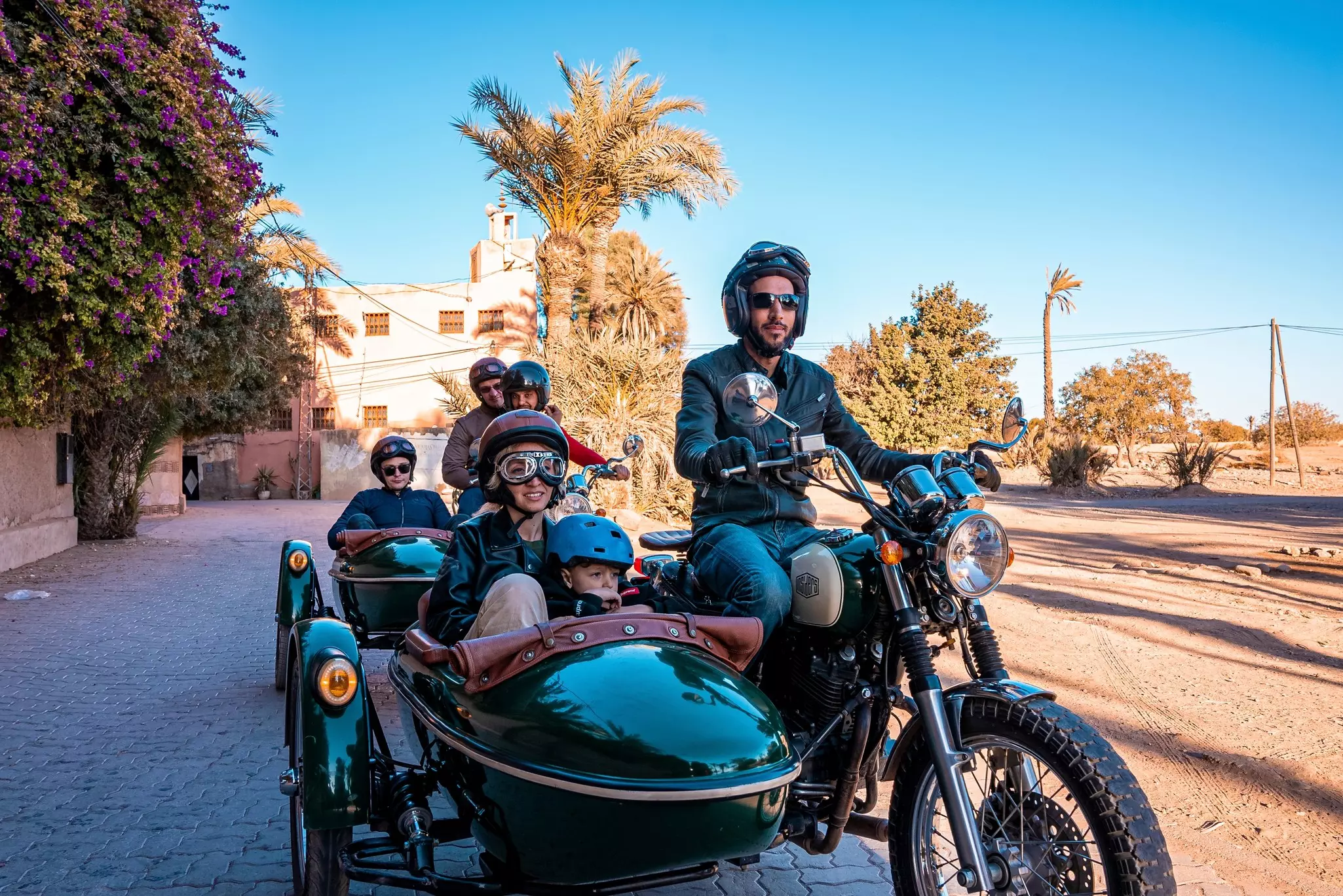 Marrakesh, Morocco. People riding motorcycle with sidecar during road trip