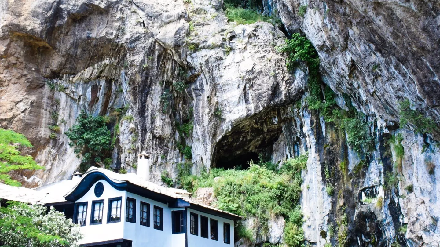 The Blagaj Tekija sits by the River Buna, overshadowed by precipitous cliffs