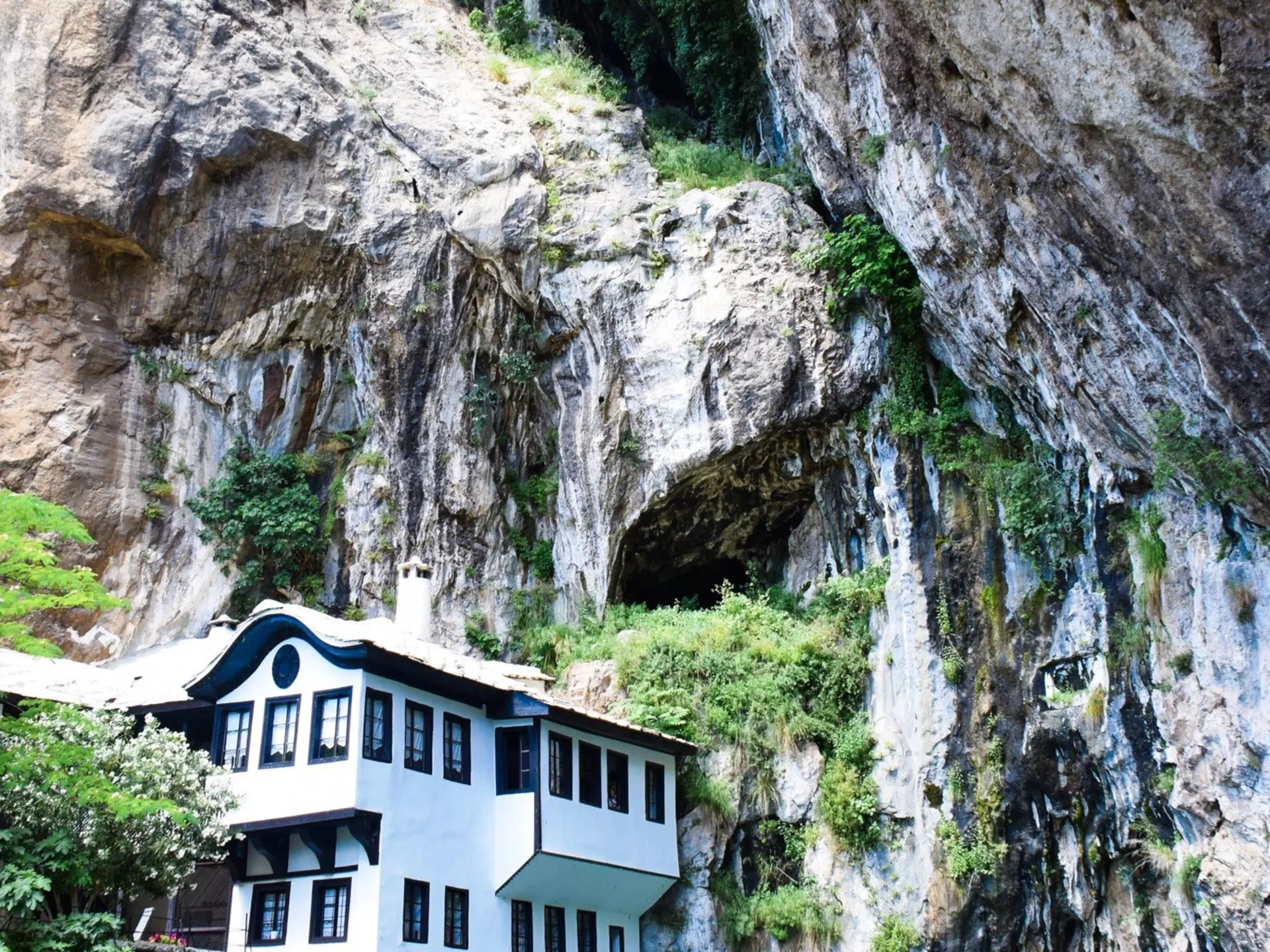 The Blagaj Tekija sits by the River Buna, overshadowed by precipitous cliffs