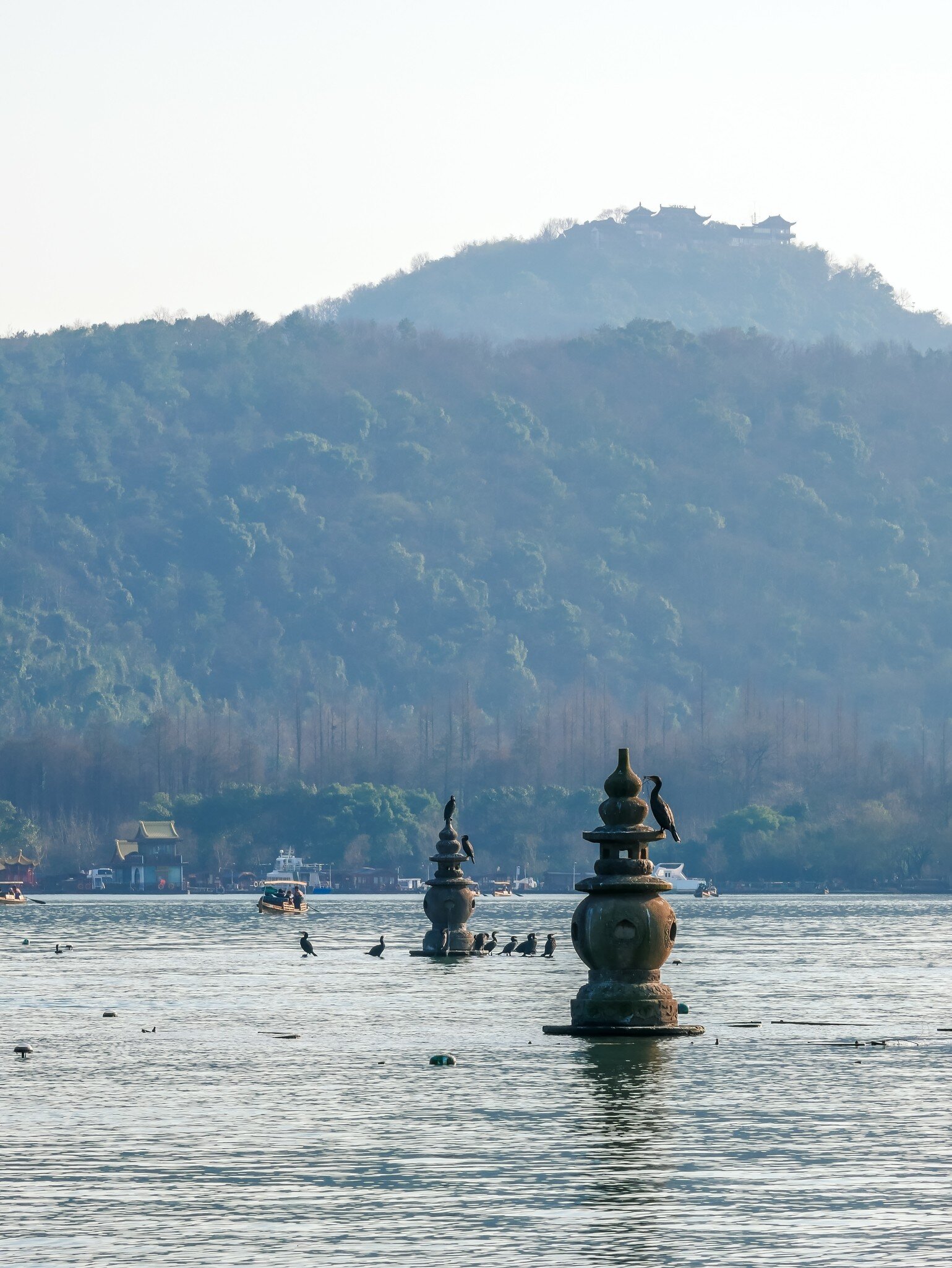 Landscape of Sanpan pagoda atThree pools mirroring the moon,located at Xihu(west lake)in hangzhou city,china, License Type: media, Download Time: 2026-08-31T22:40:29.000Z, User: LP_NZhan, Editorial: false, purchase_order: 65050 - Digital Destinations and Articles, job: App Content, client: Lonely Planet App, other: Nadine Zhan