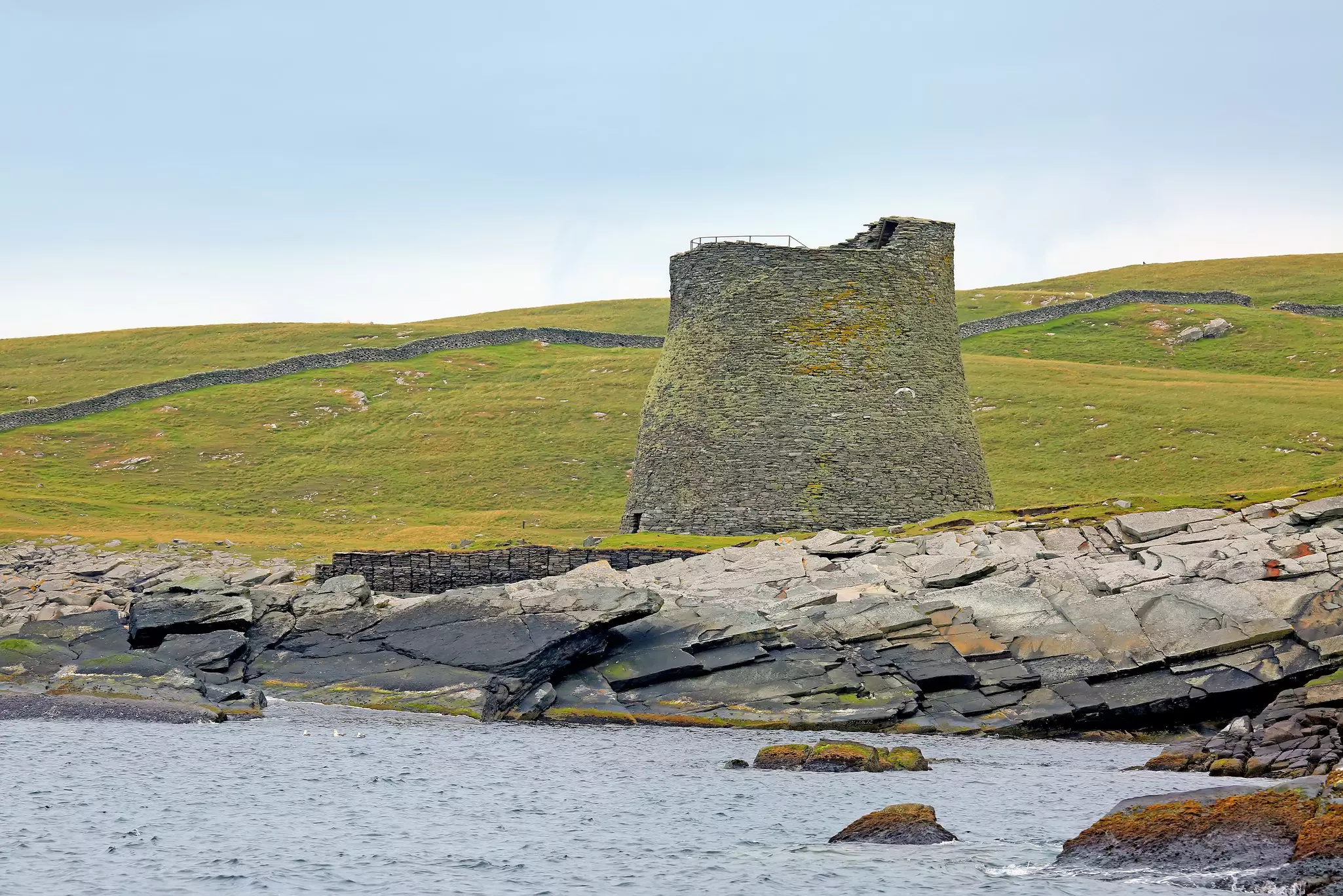 The Broch of Mousa, an Iron Age round tower on the rocky coastline of Mousa in Shetland, Scotland.