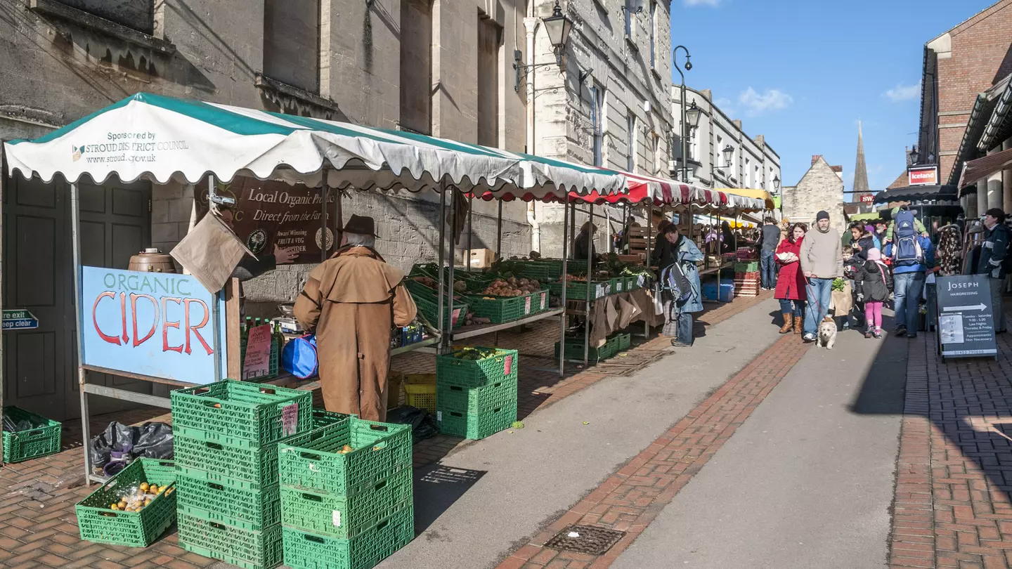 Pedestrians shopping at the busy weekend farmers market in Stroud, the Cotswolds, England, United Kingdom