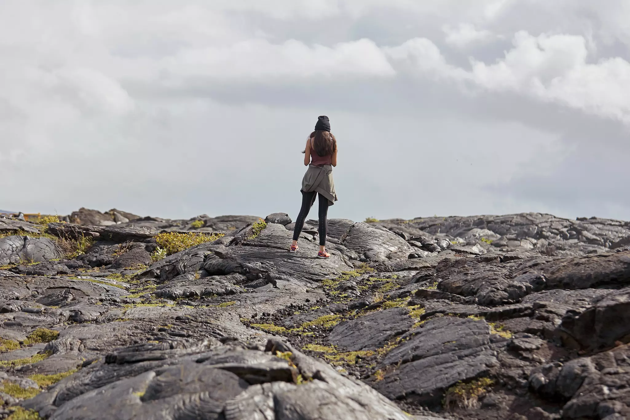 A woman Traveling at Kilauea volcano lava fields Volcano National Park Hawaii