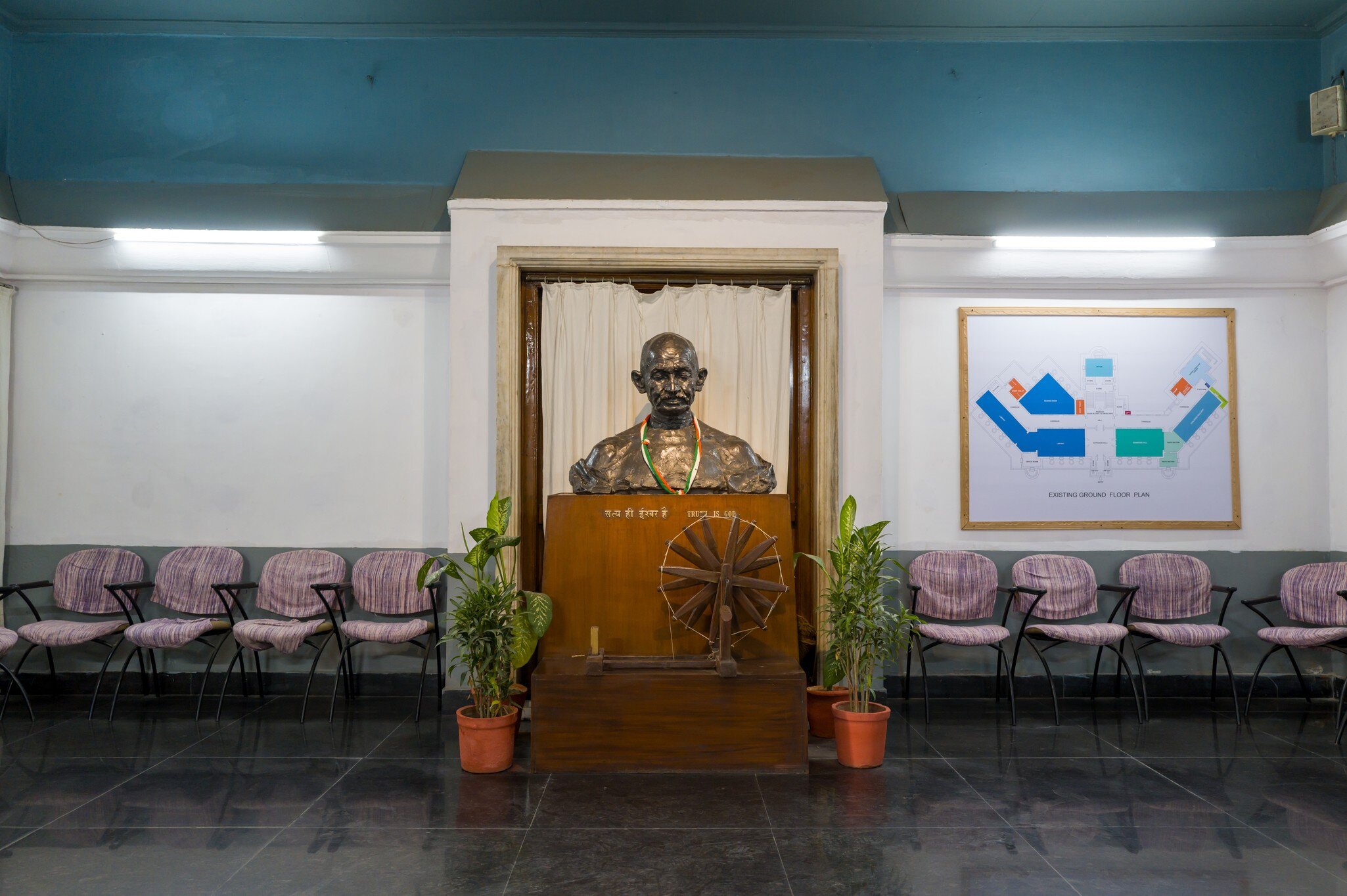 Interior of the National Gandhi Museum with a sculpture of Mahatma Gandhi in New Delhi, India.