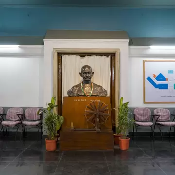 Interior of the National Gandhi Museum with a sculpture of Mahatma Gandhi in New Delhi, India.