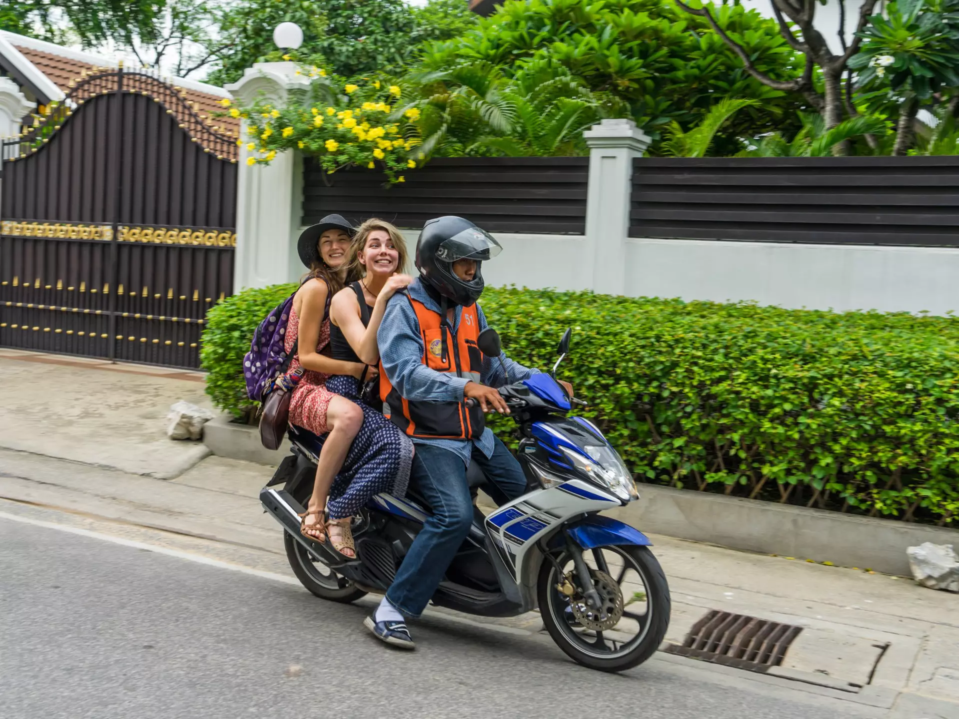 Editorial use only; happy tourists take a motorcycle taxi in Bangkok, on July 21st, 2016, at Sukhumvit street 56., License Type: media, Download Time: 2025-05-28T09:53:28.000Z, User: lonelyplanetmedia, Editorial: true, purchase_order: 65050 - Digital Destinations and Articles, job: Global Publishing WIP, client: Global Publishing WIP, other: Peterson Haggarty // SS Comp Ingestion