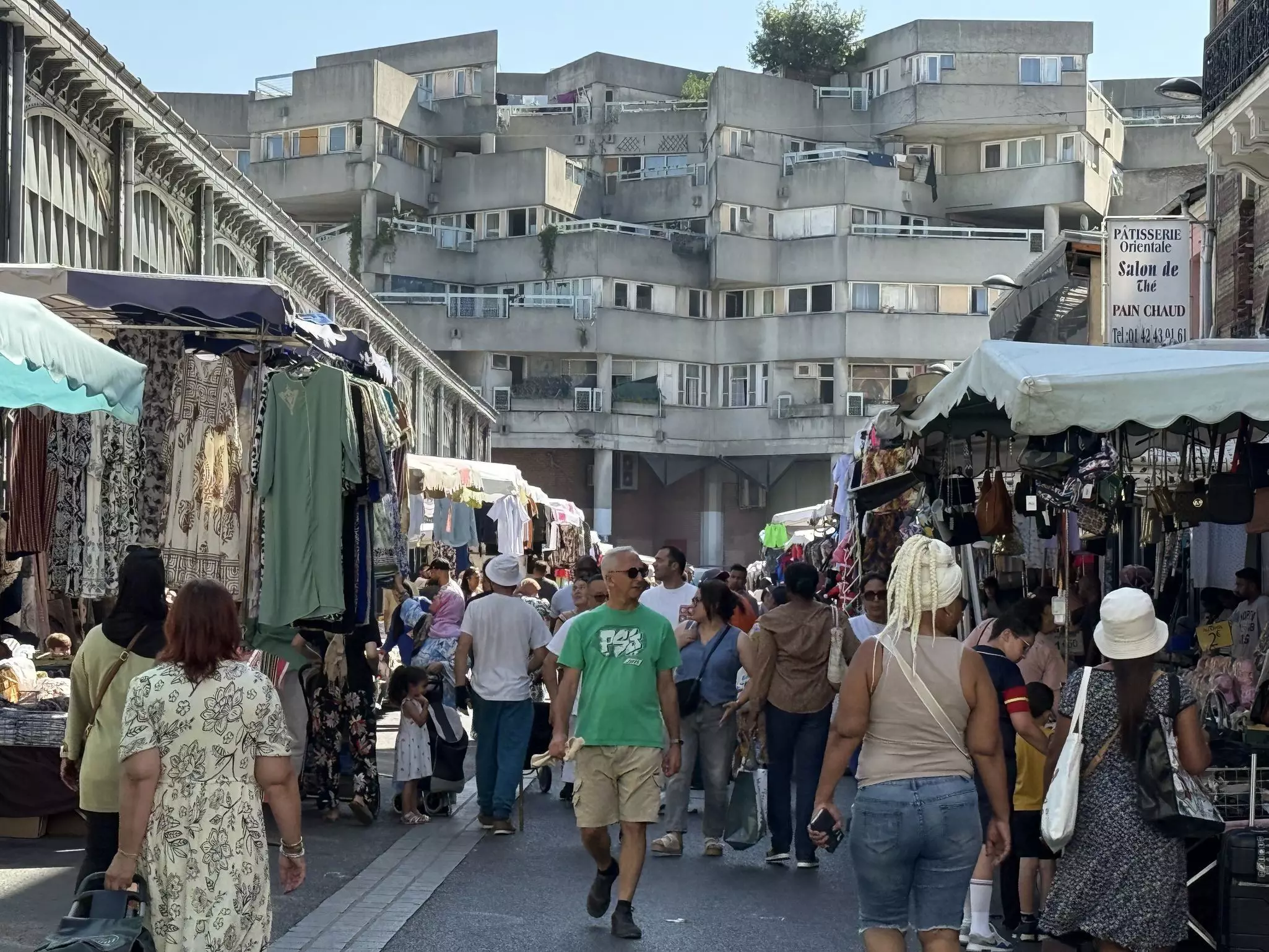 Market hall beside Brutalist buildings in the suburb of Saint-Denis, Paris
