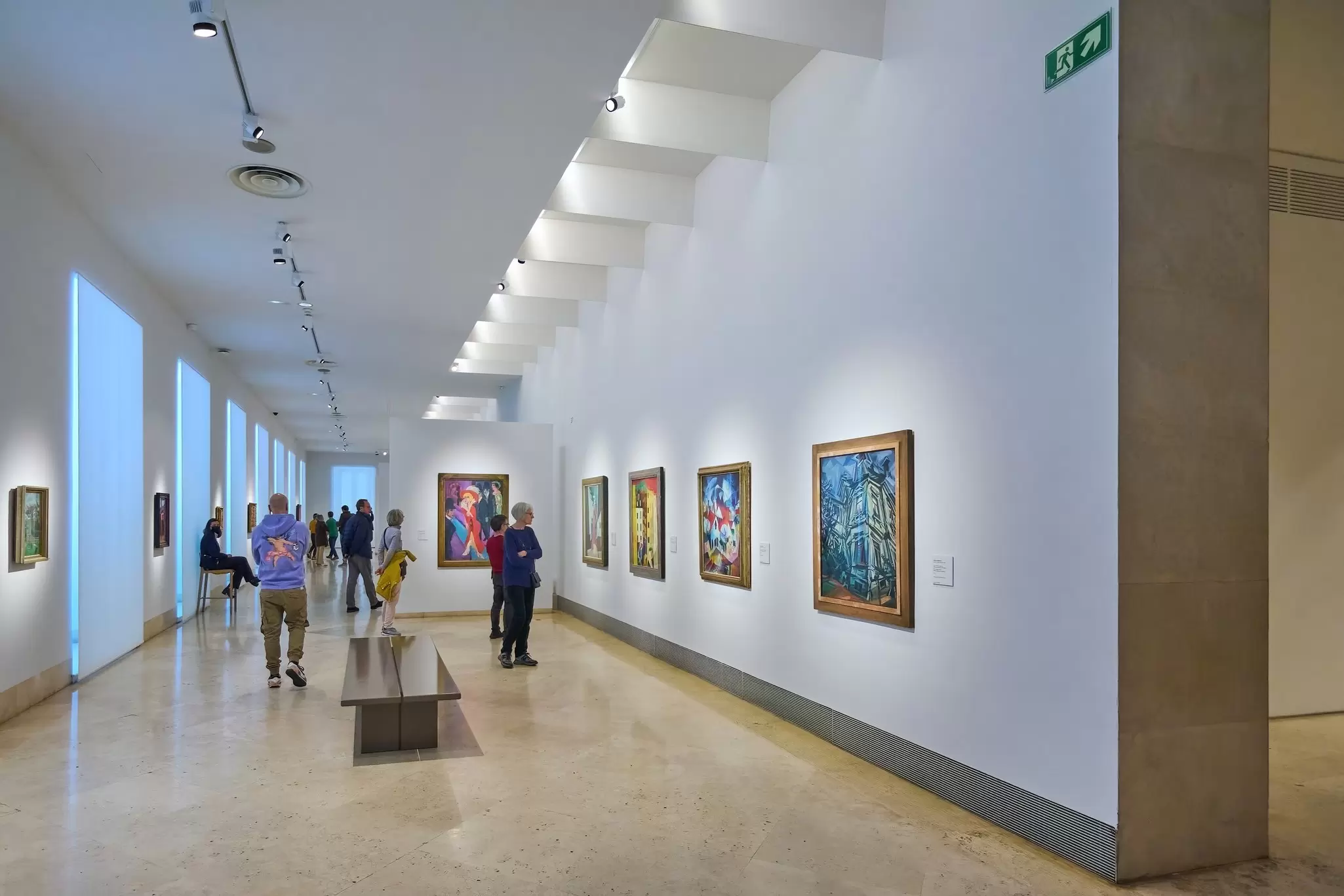 Visitors viewing artwork at the Thyssen-Bornemisza museum in Madrid, Spain.