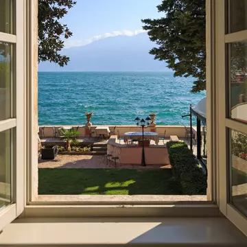 Window view to Lake Como in Italy.