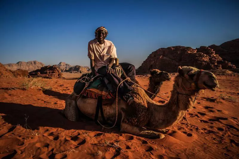 Drive past rust-colored dunes in Wadi Rum on an off-road adventure © Herre van der Wal / Lonely Planet
