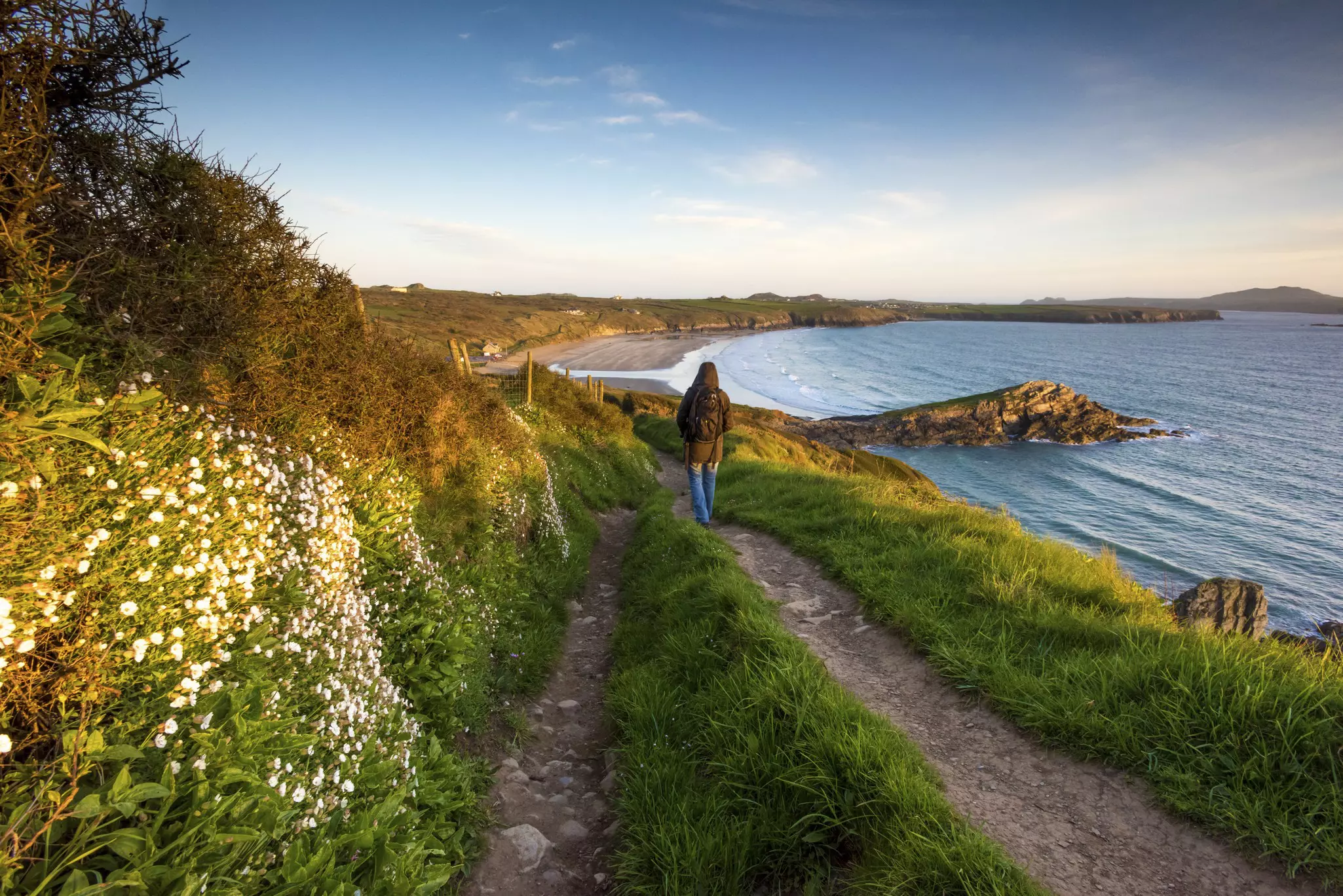 Walker on the Pembrokeshire coast path at Whitesands near St Davids. ©Michael Roberts/Getty Images