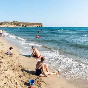 Patara, Antalya, Turkey  August 12, 2021. Patara beach in Antalya province of Turkey, with people. The splendid 18-km long sandy beach is backed by large sand dunes.