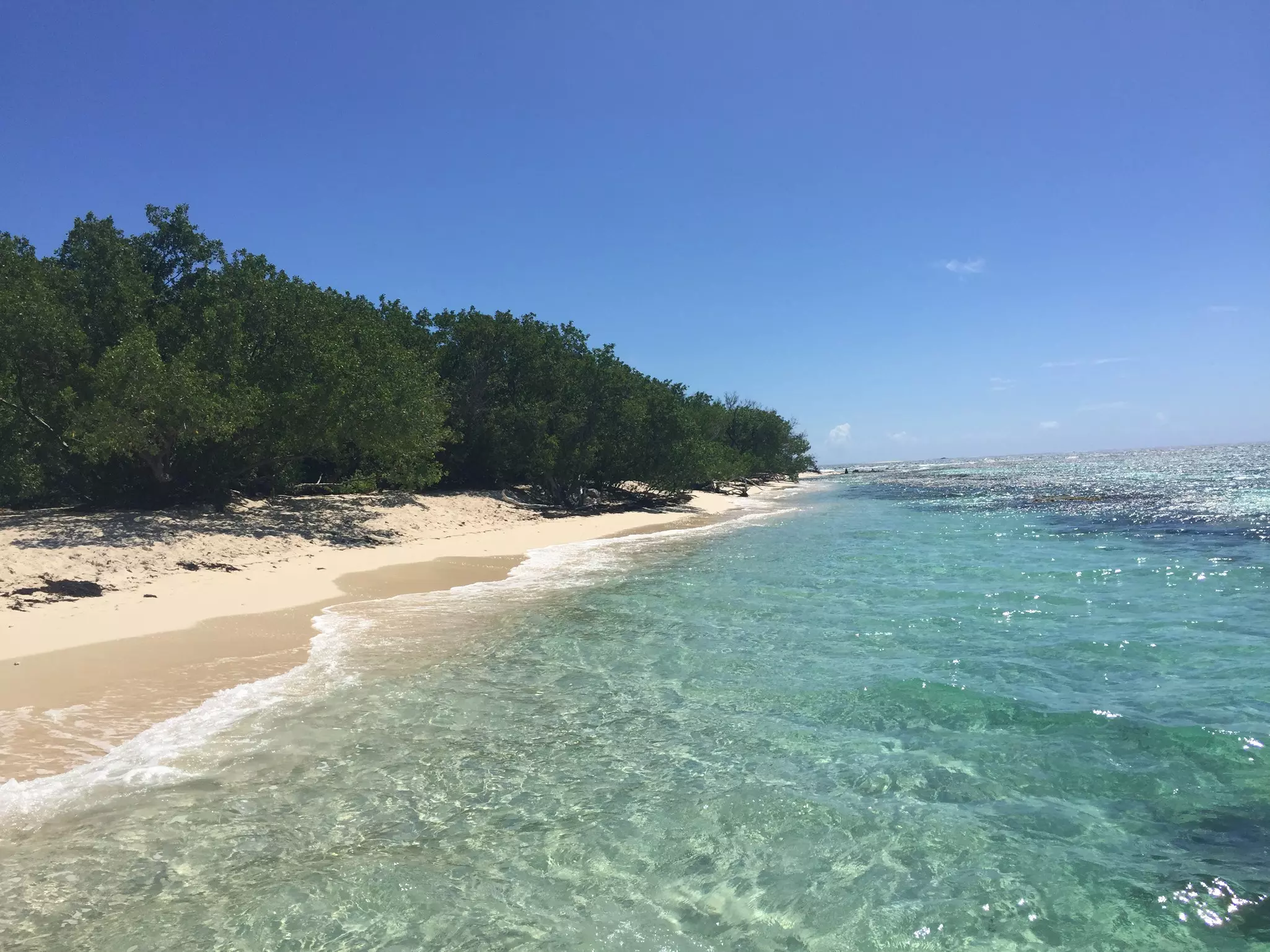 Empty sand sliding into the Caribbean on Lime Cay near Kingston, Jamaica.